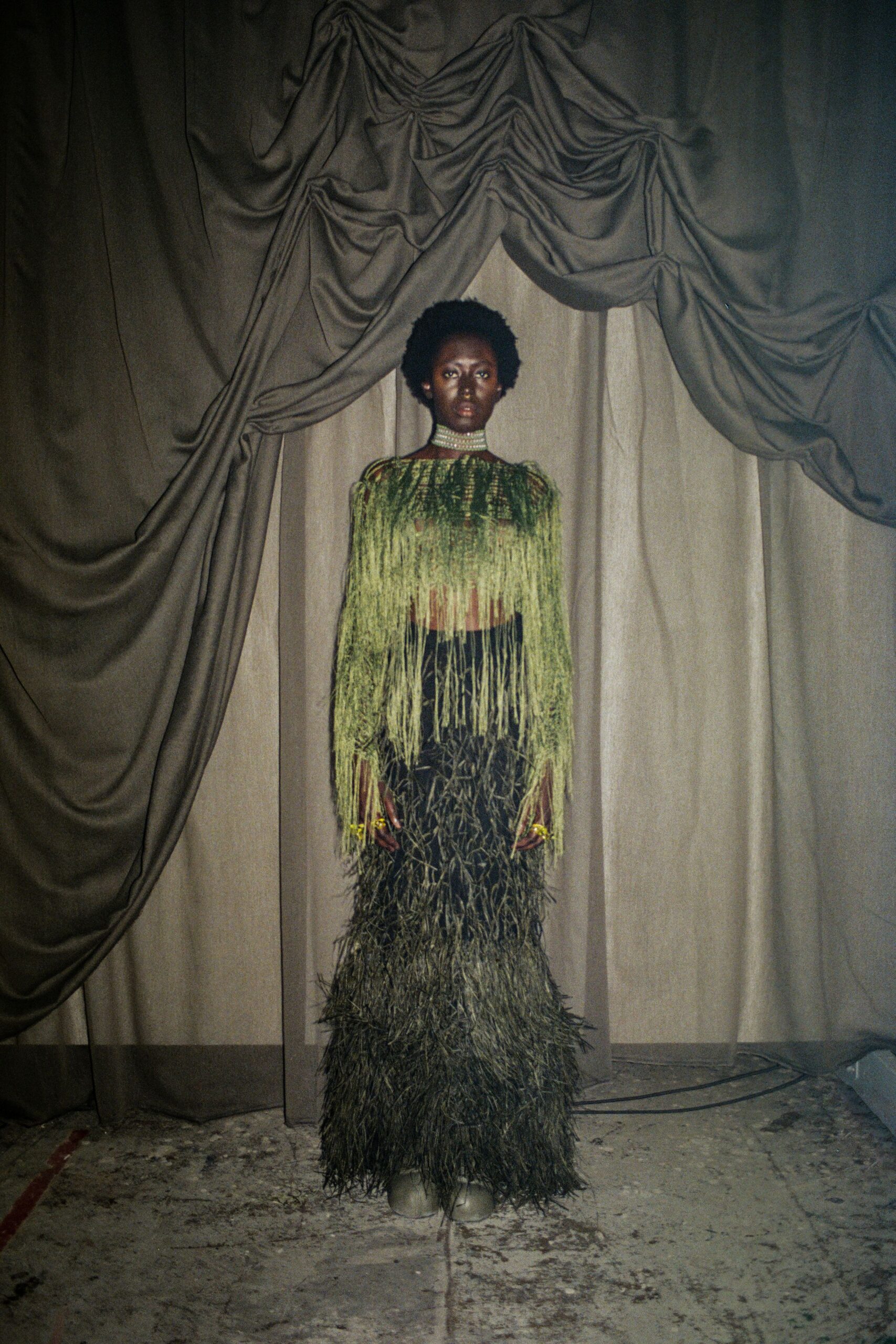 green fringed top black skirt