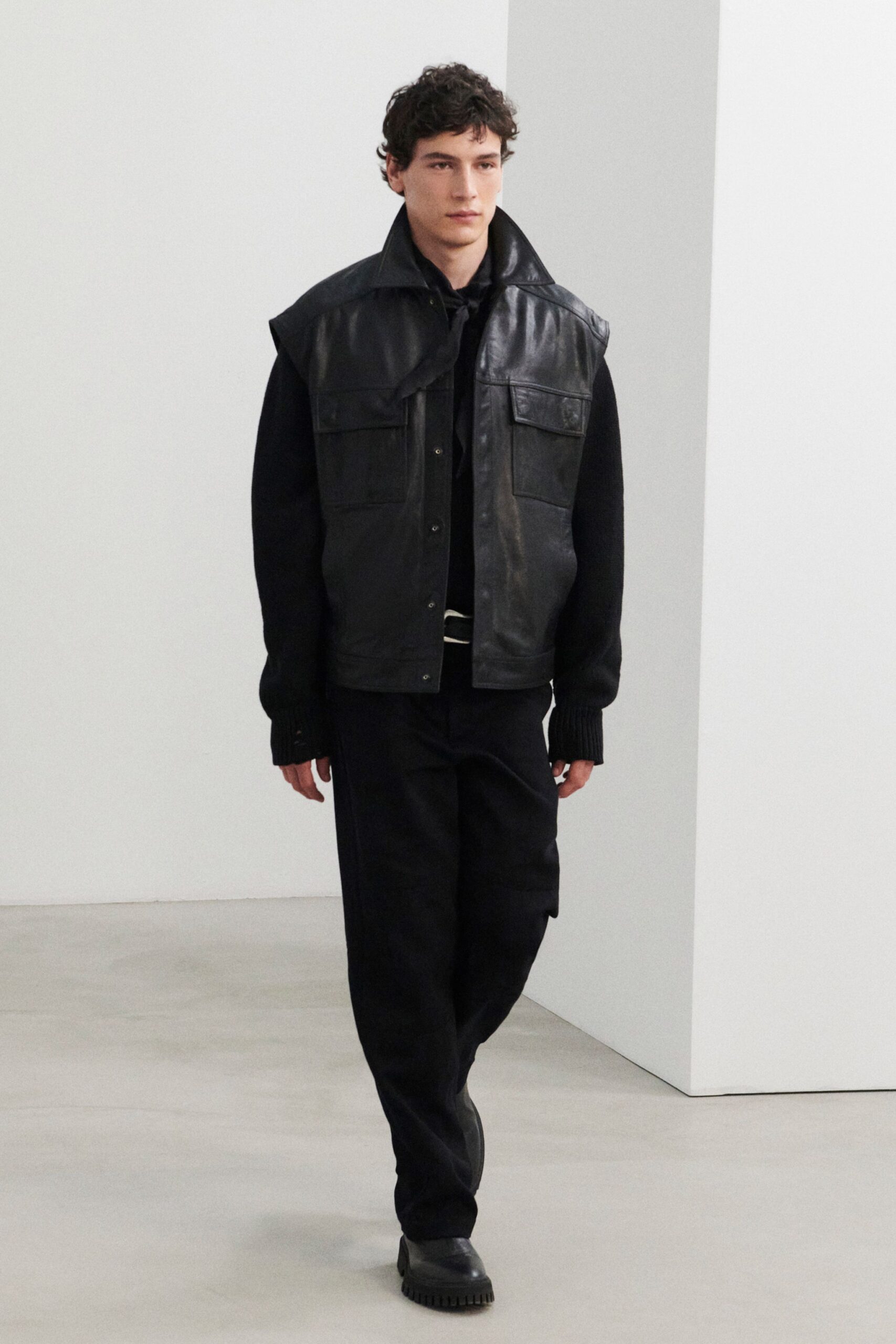 black leather long-sleeve collared relaxed buttoned pockets jacket