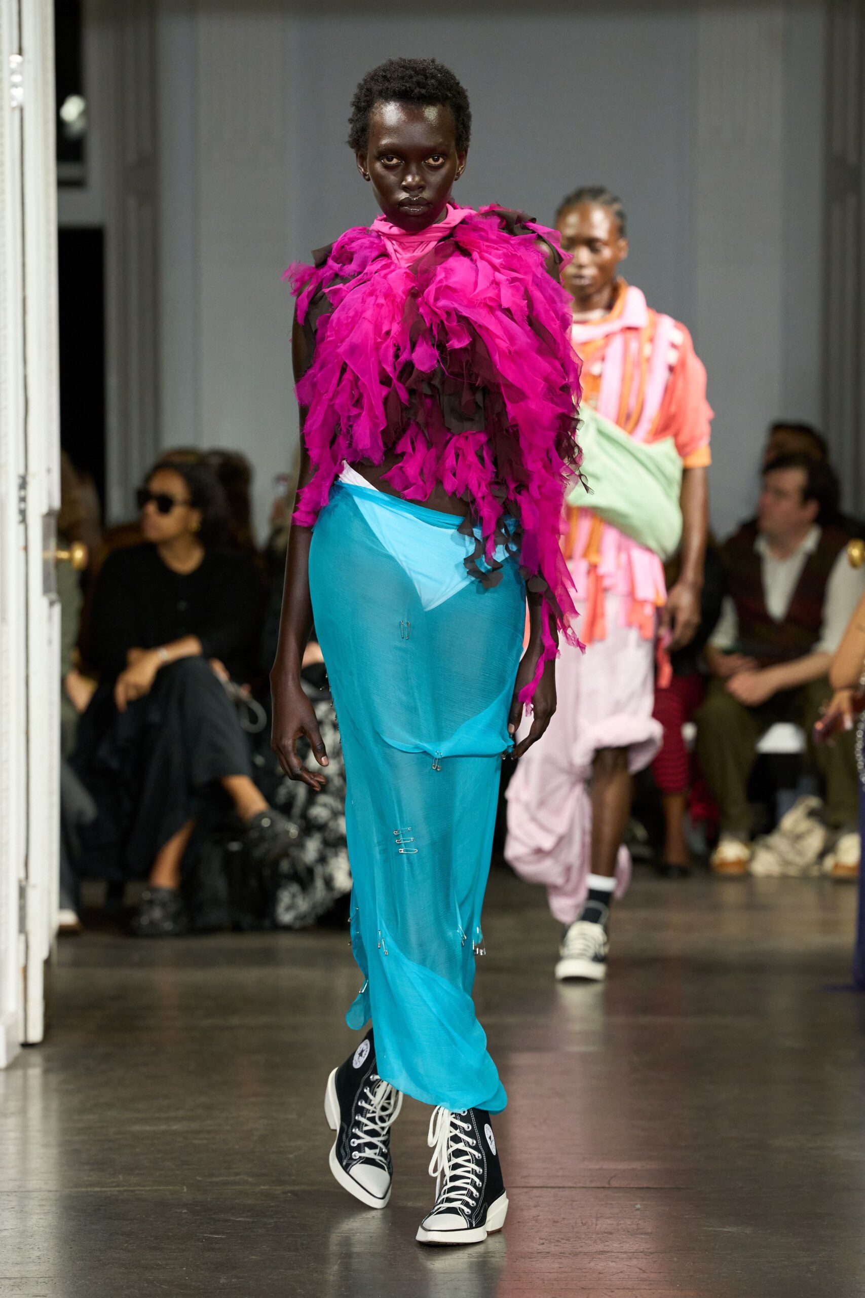 pink ruffled top with blue skirt