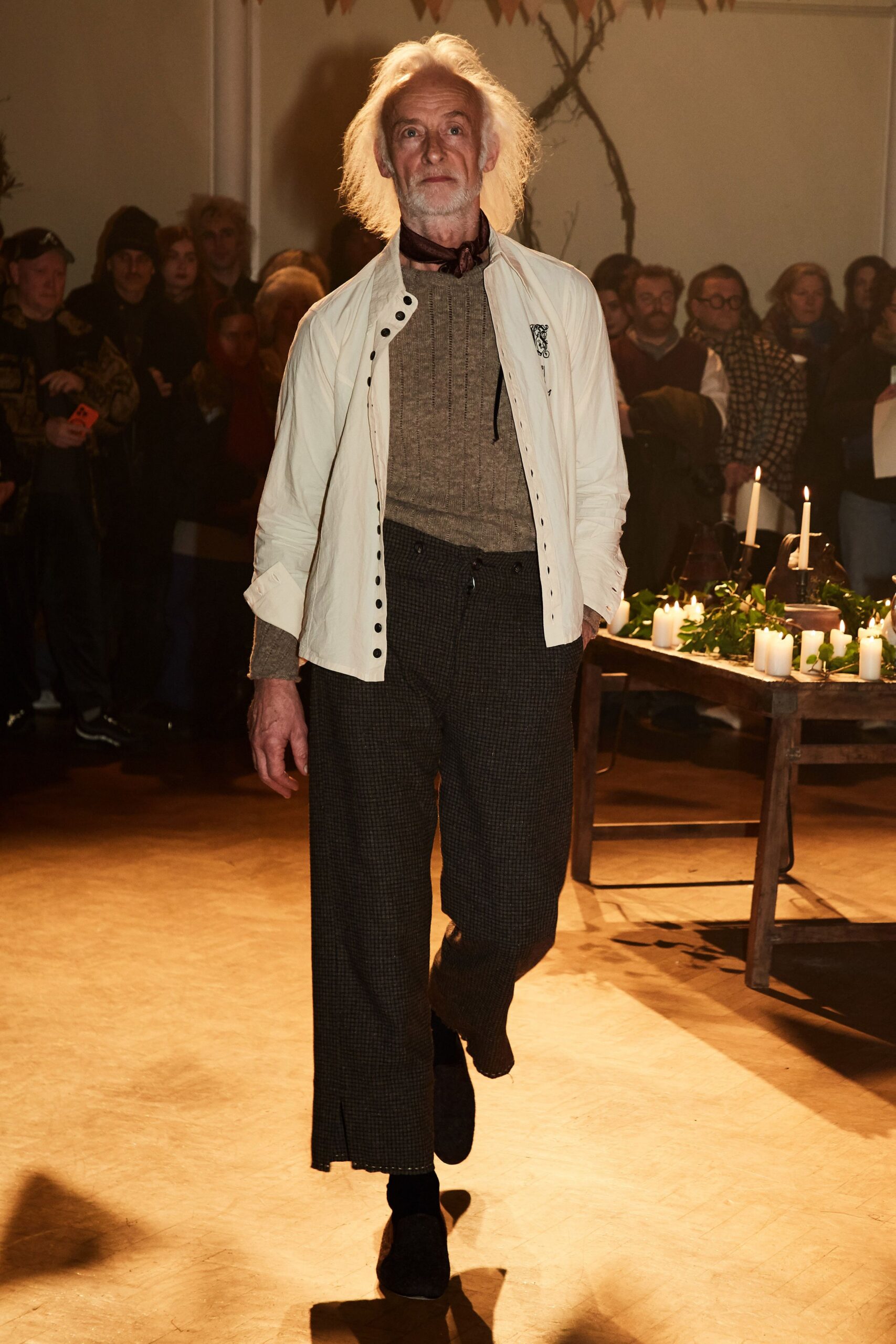 white jacket beige sweater gray pants
