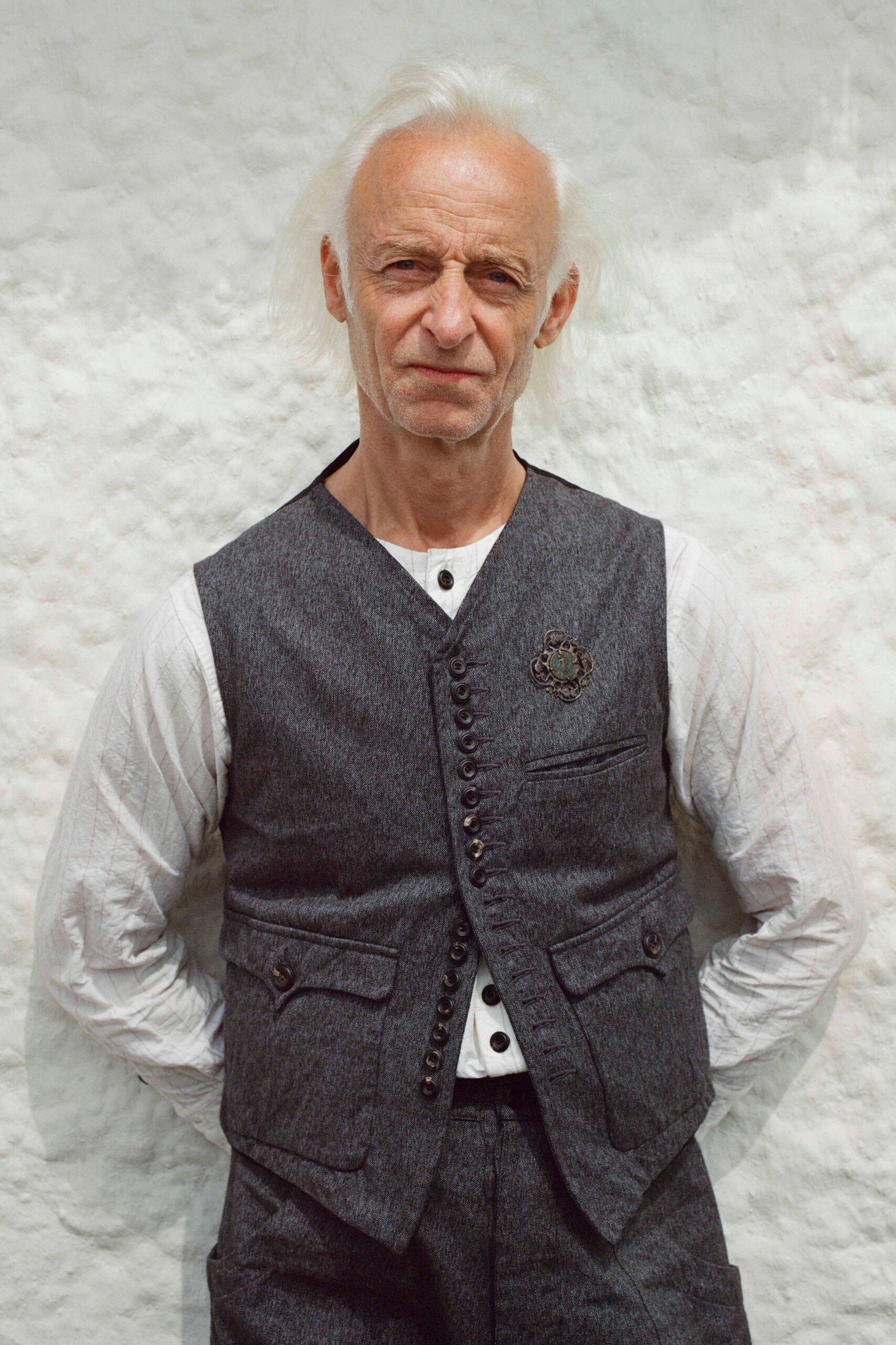 gray wool long-sleeve collared fitted buttoned pockets vest