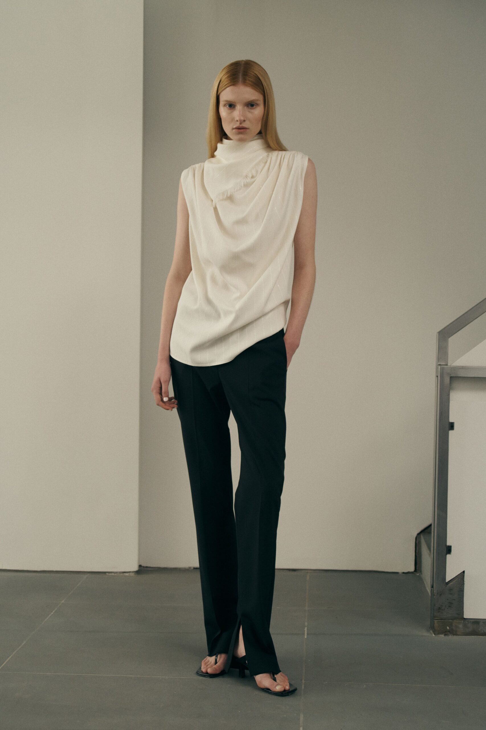 white relaxed top with black tailored pants