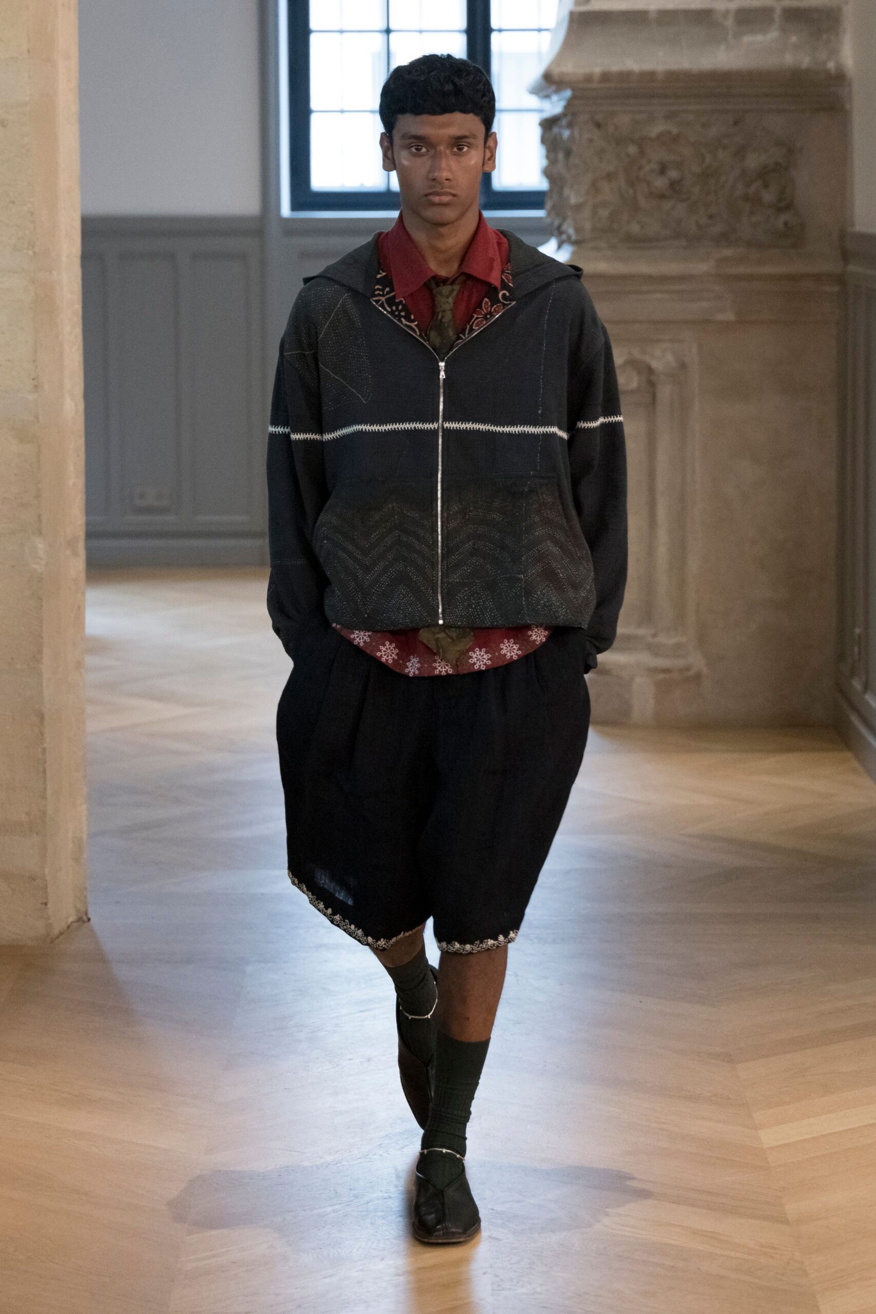 black relaxed jacket with red shirt