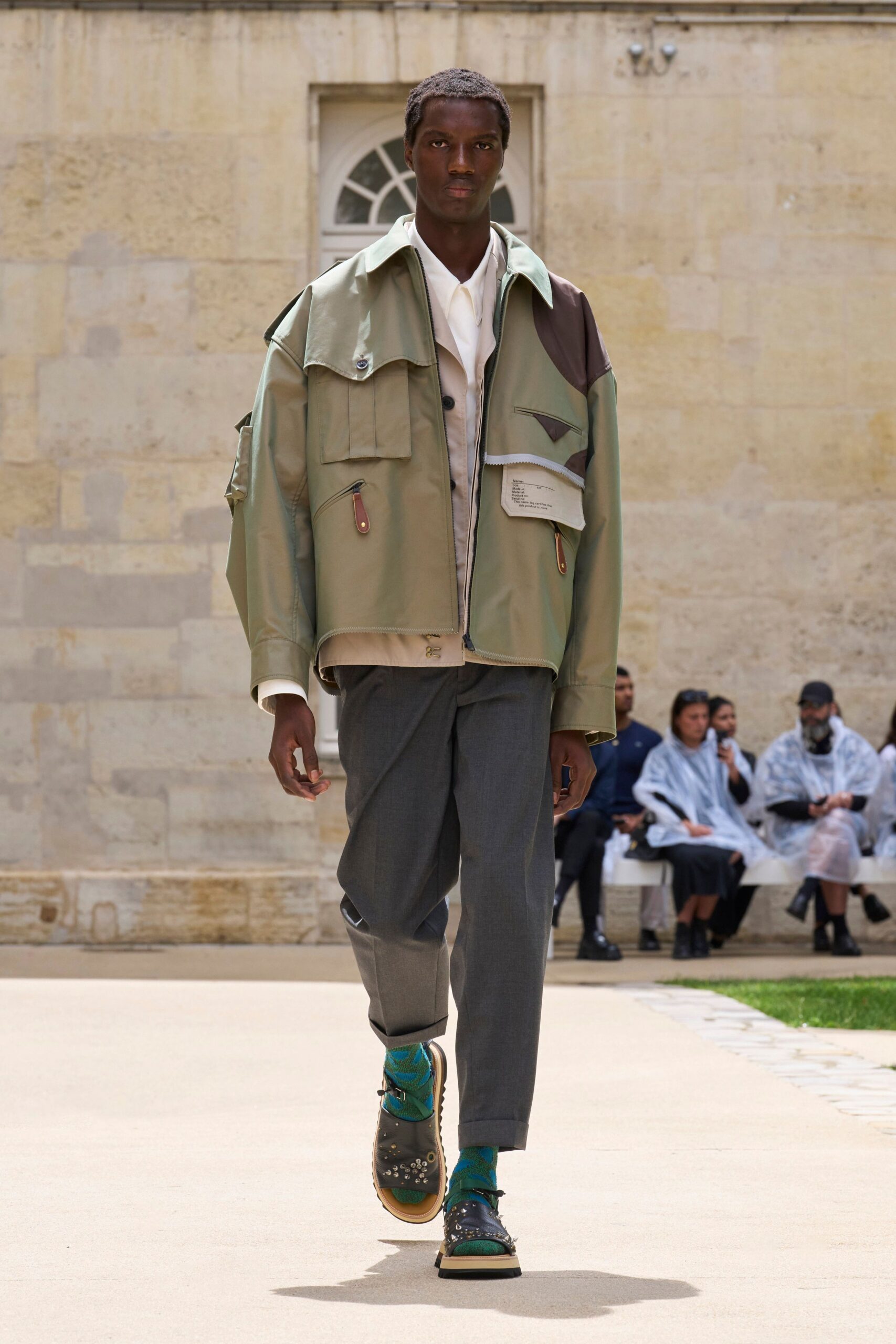 green relaxed jacket with gray pants