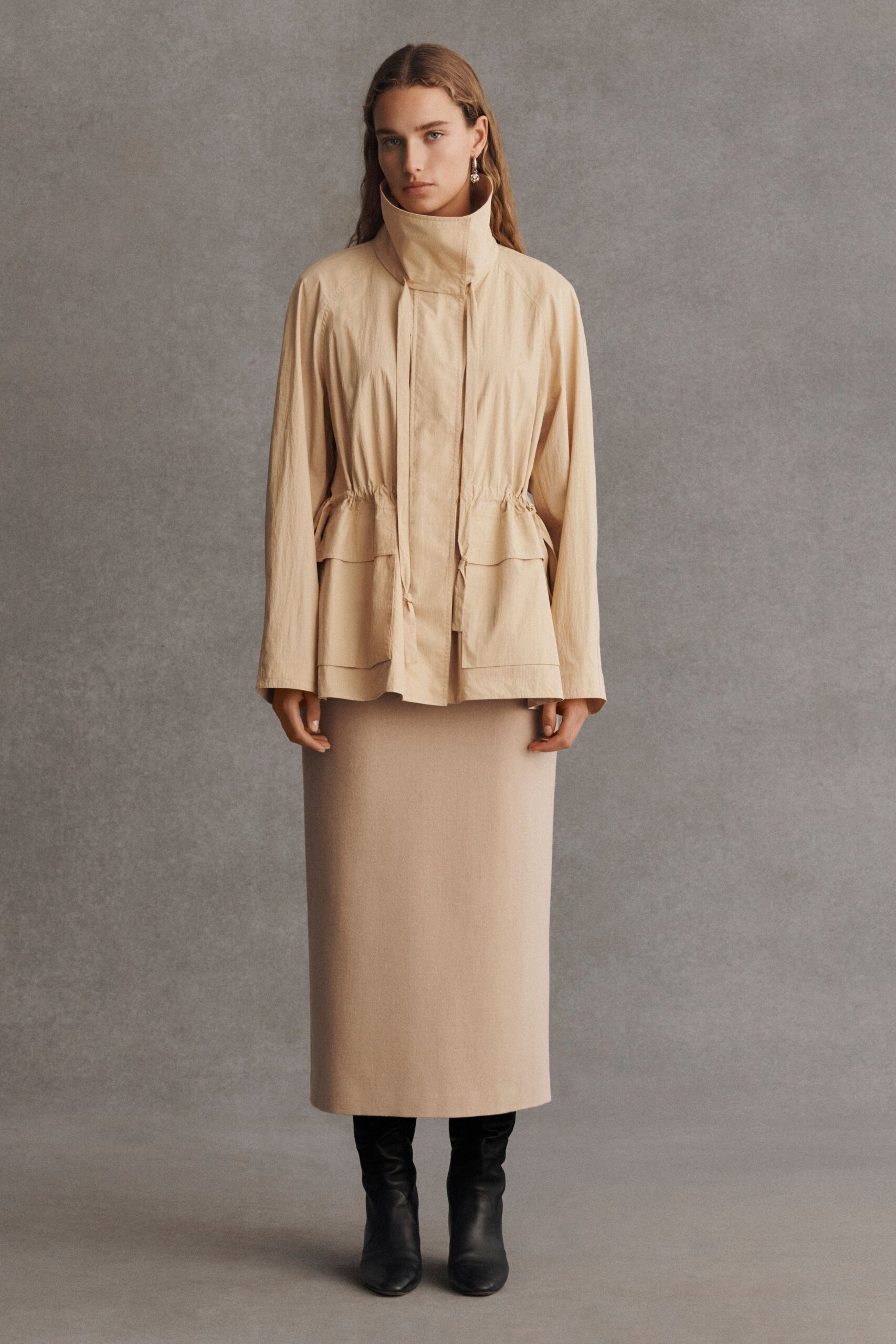 beige cotton jacket and skirt with black boots