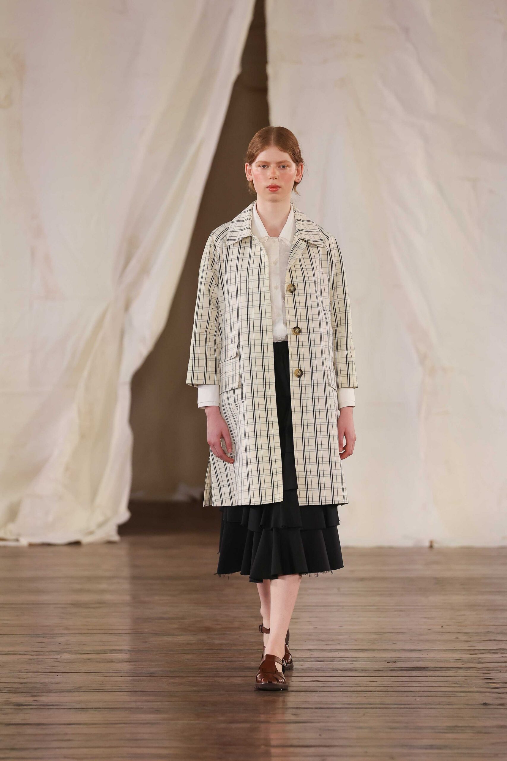 checked coat with black skirt