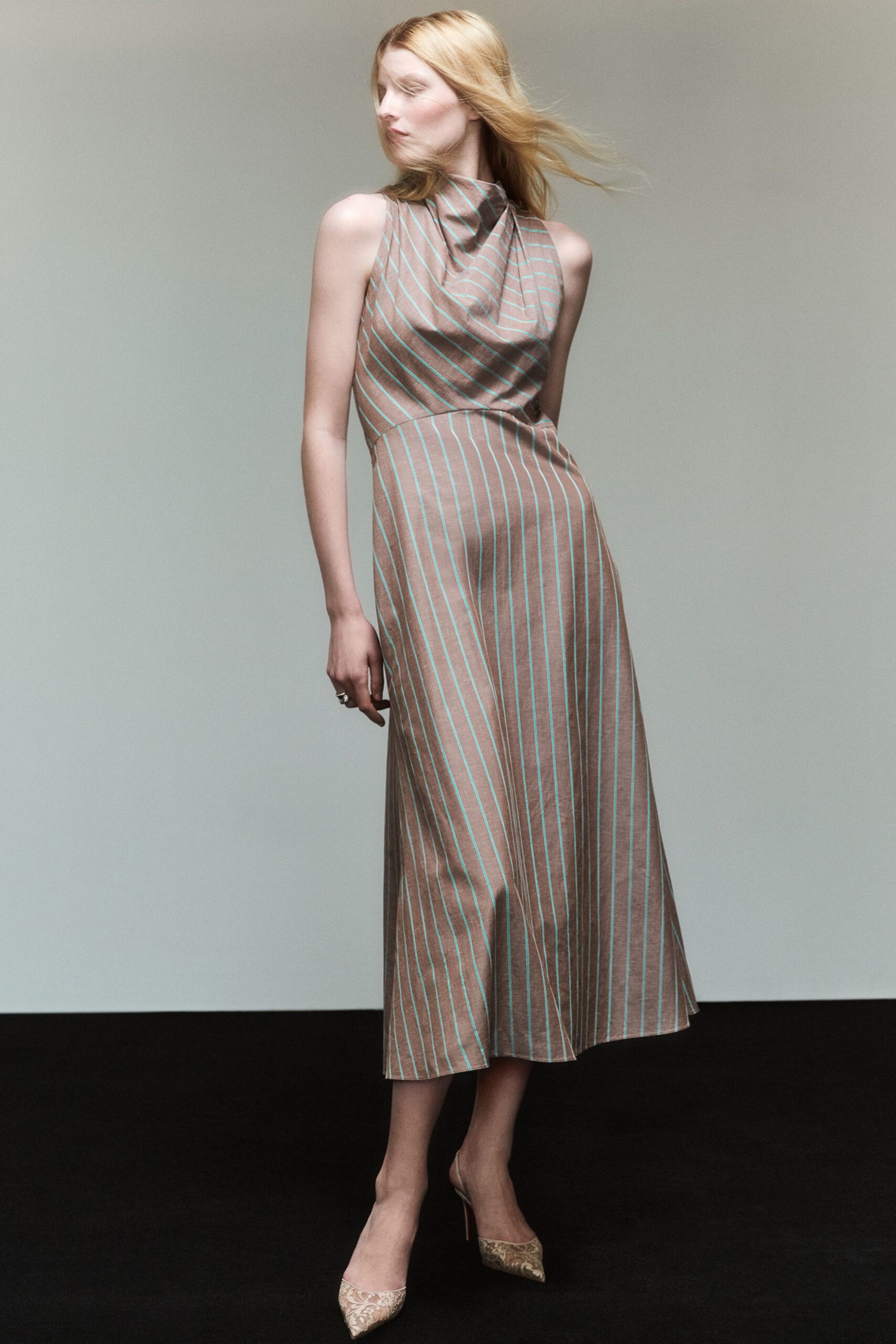 brown striped midi dress with gold shoes