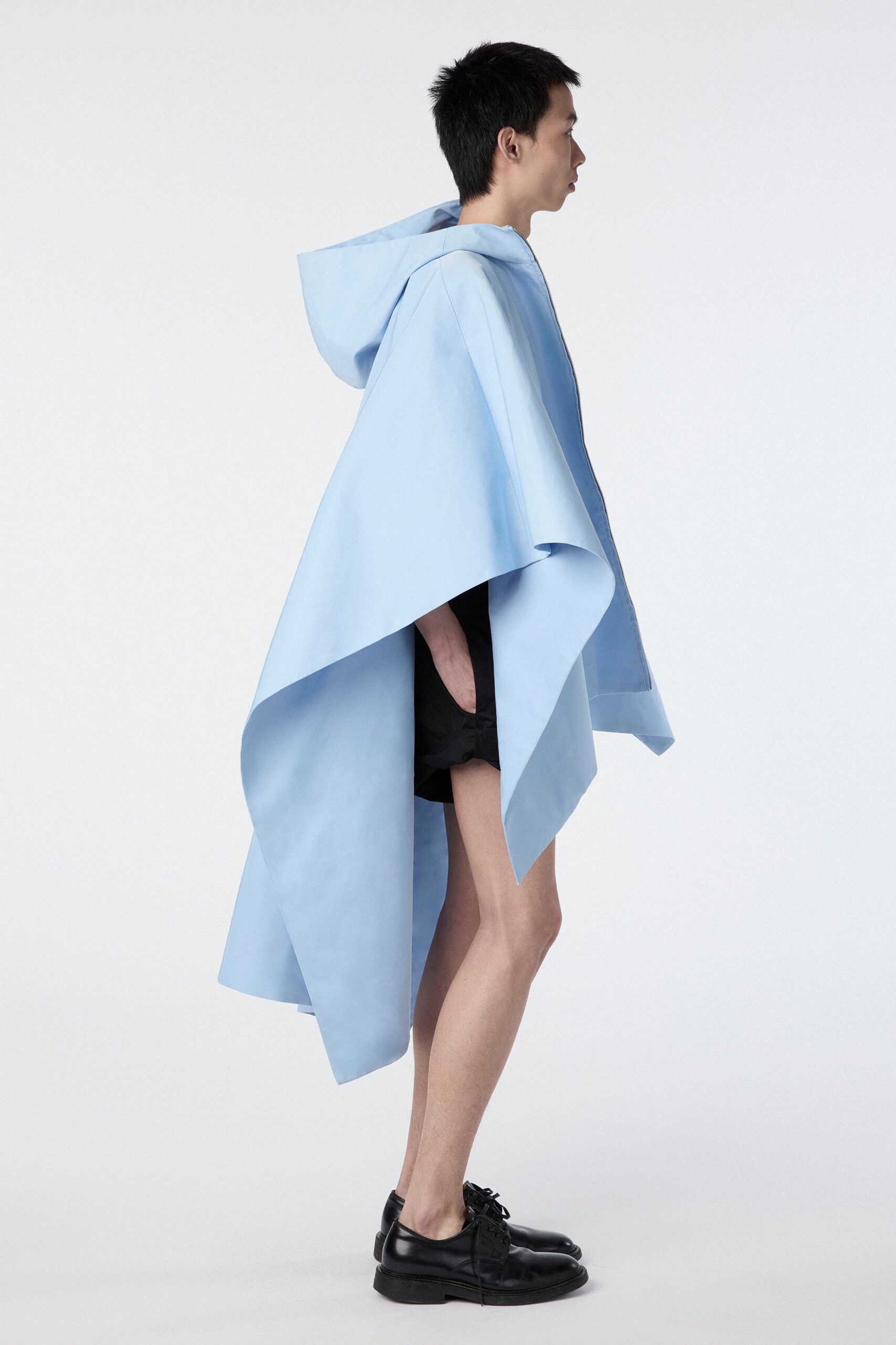 blue cotton poncho with black shorts