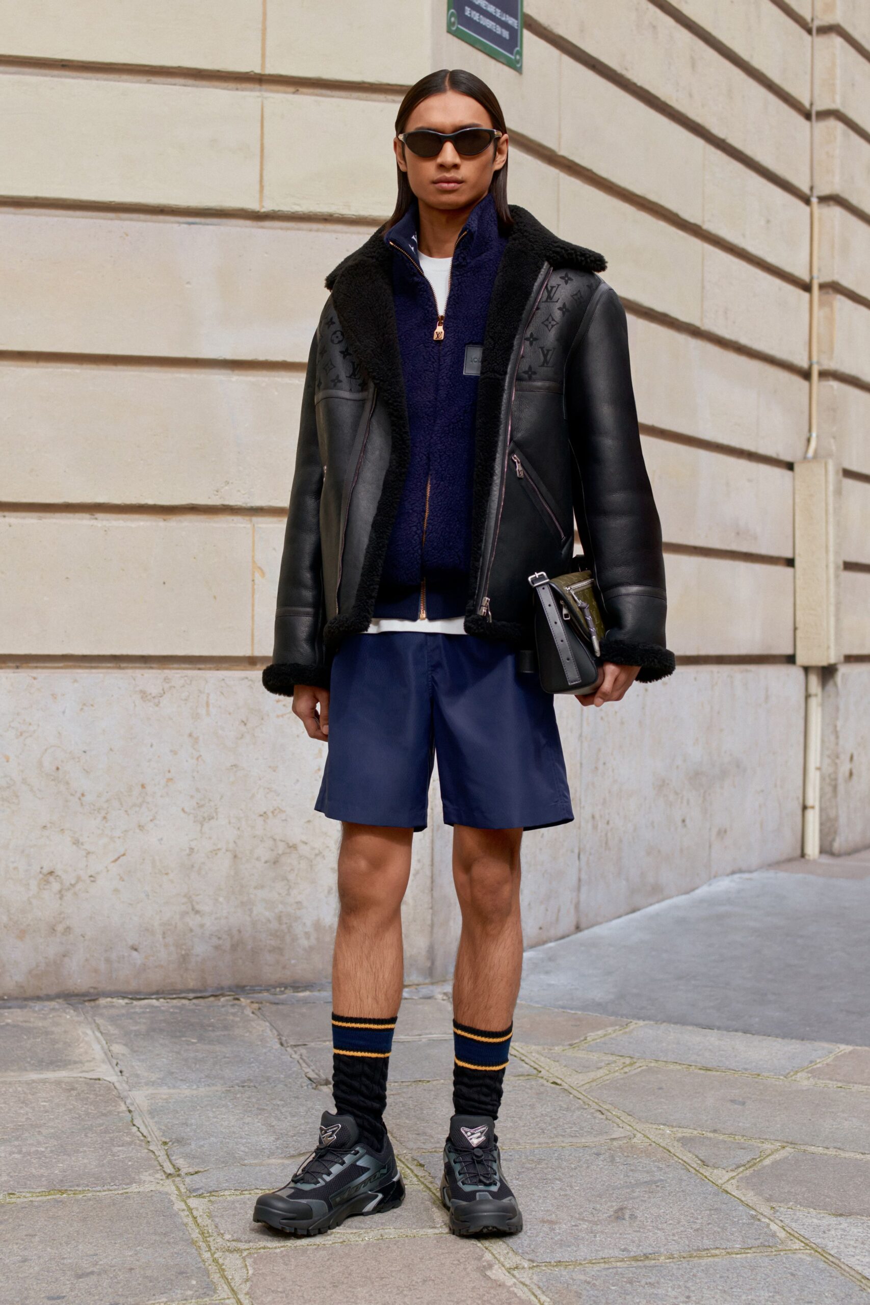 black leather jacket with navy shorts