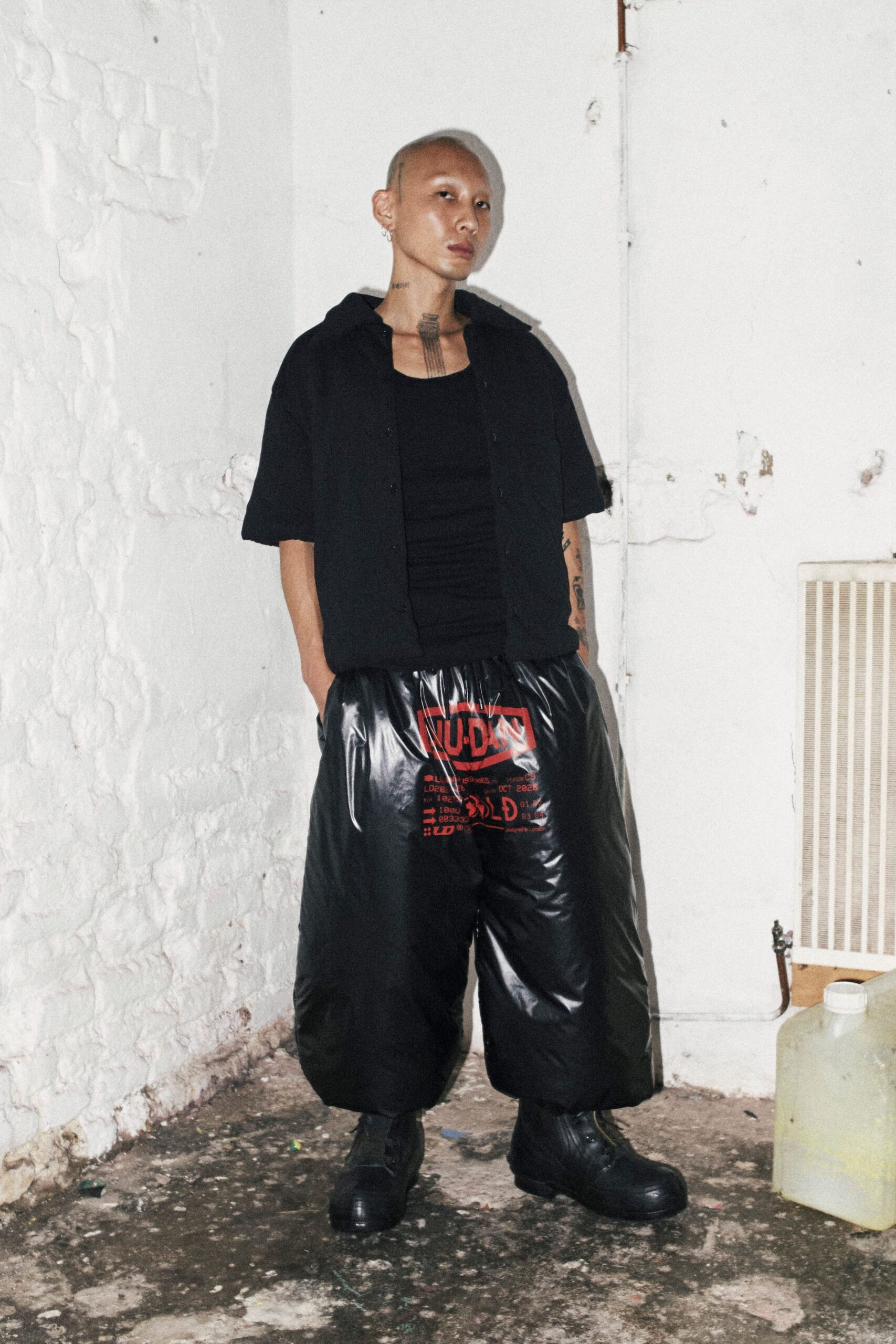 black relaxed shirt with vinyl pants