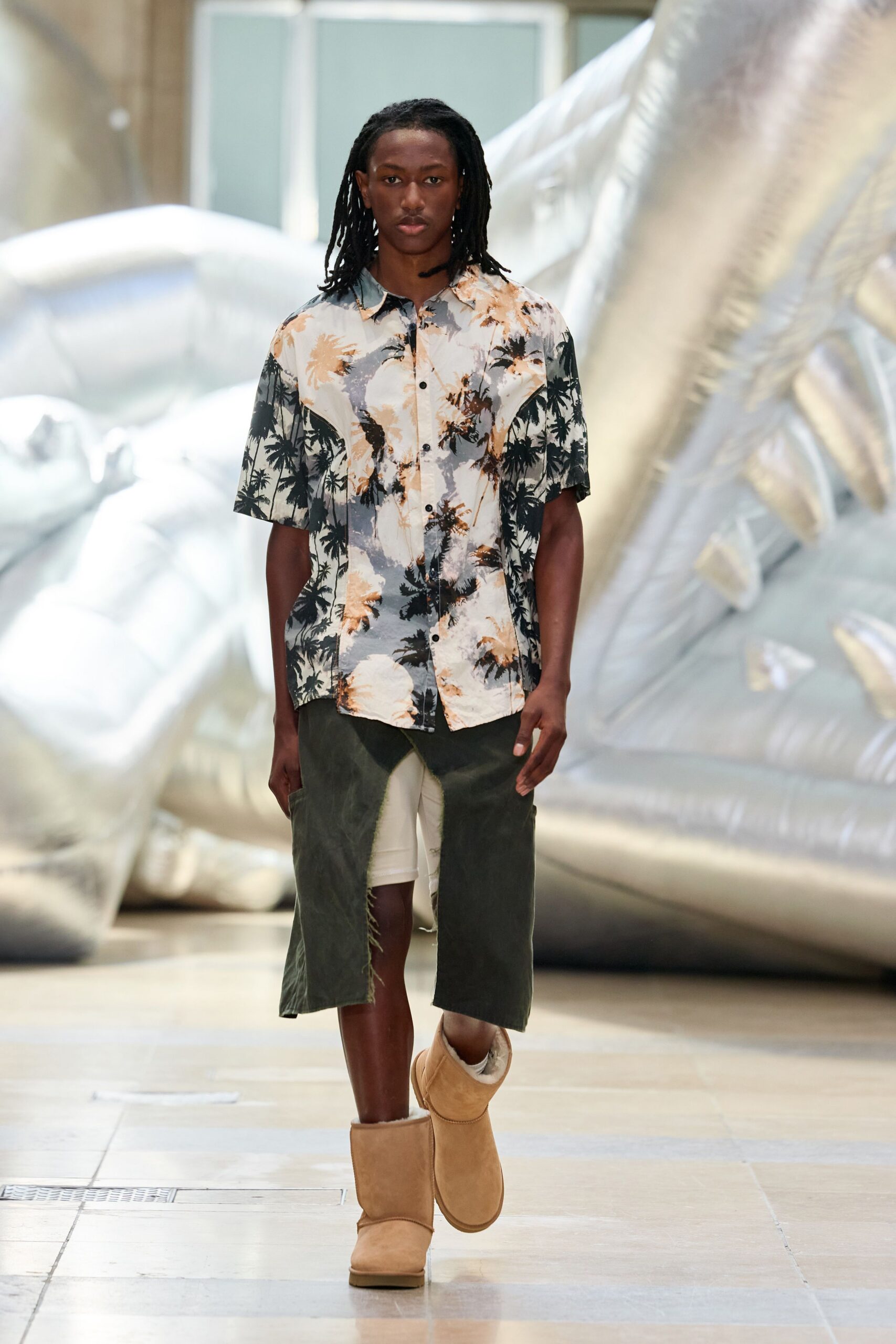 floral shirt with beige shorts