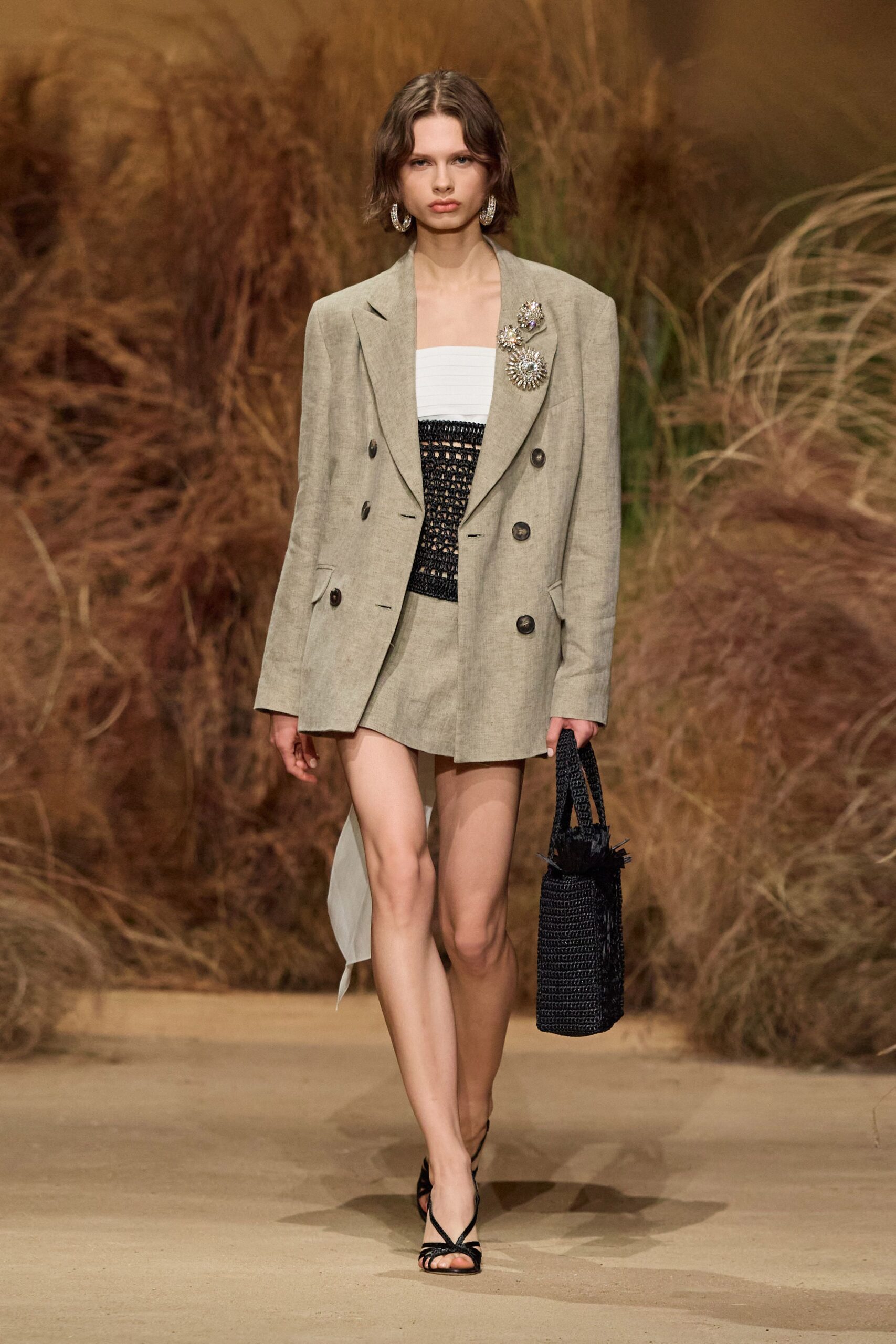 beige tailored blazer with black mini skirt