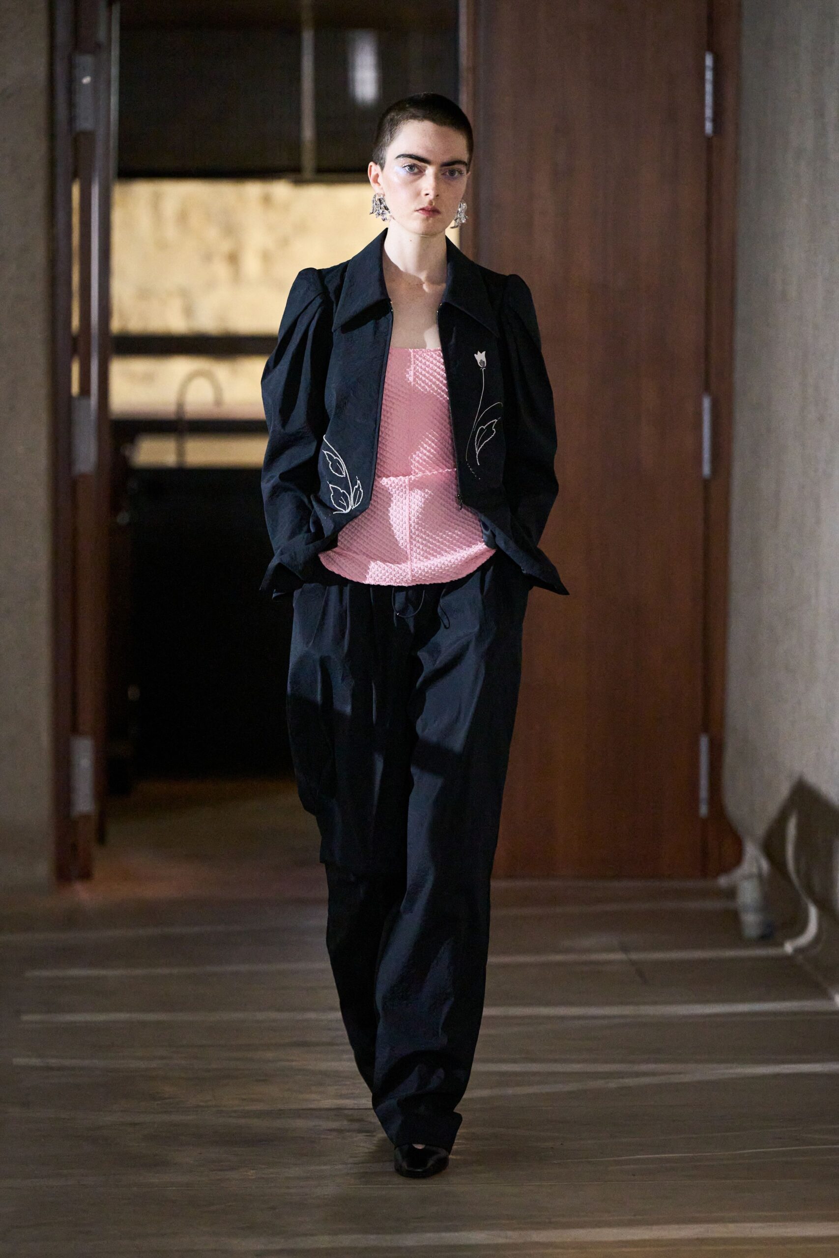 black structured jacket with pink top