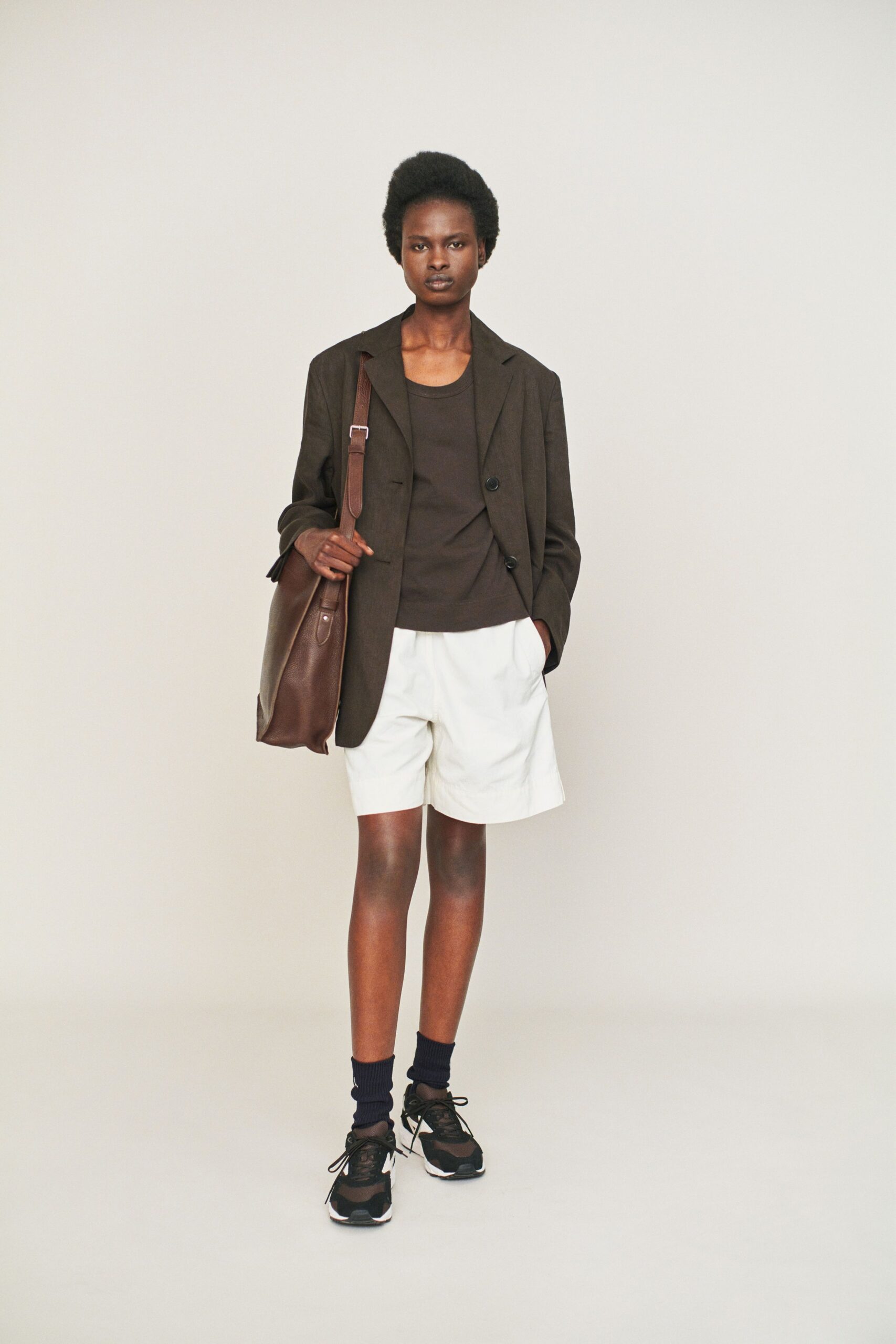 brown blazer black top white shorts