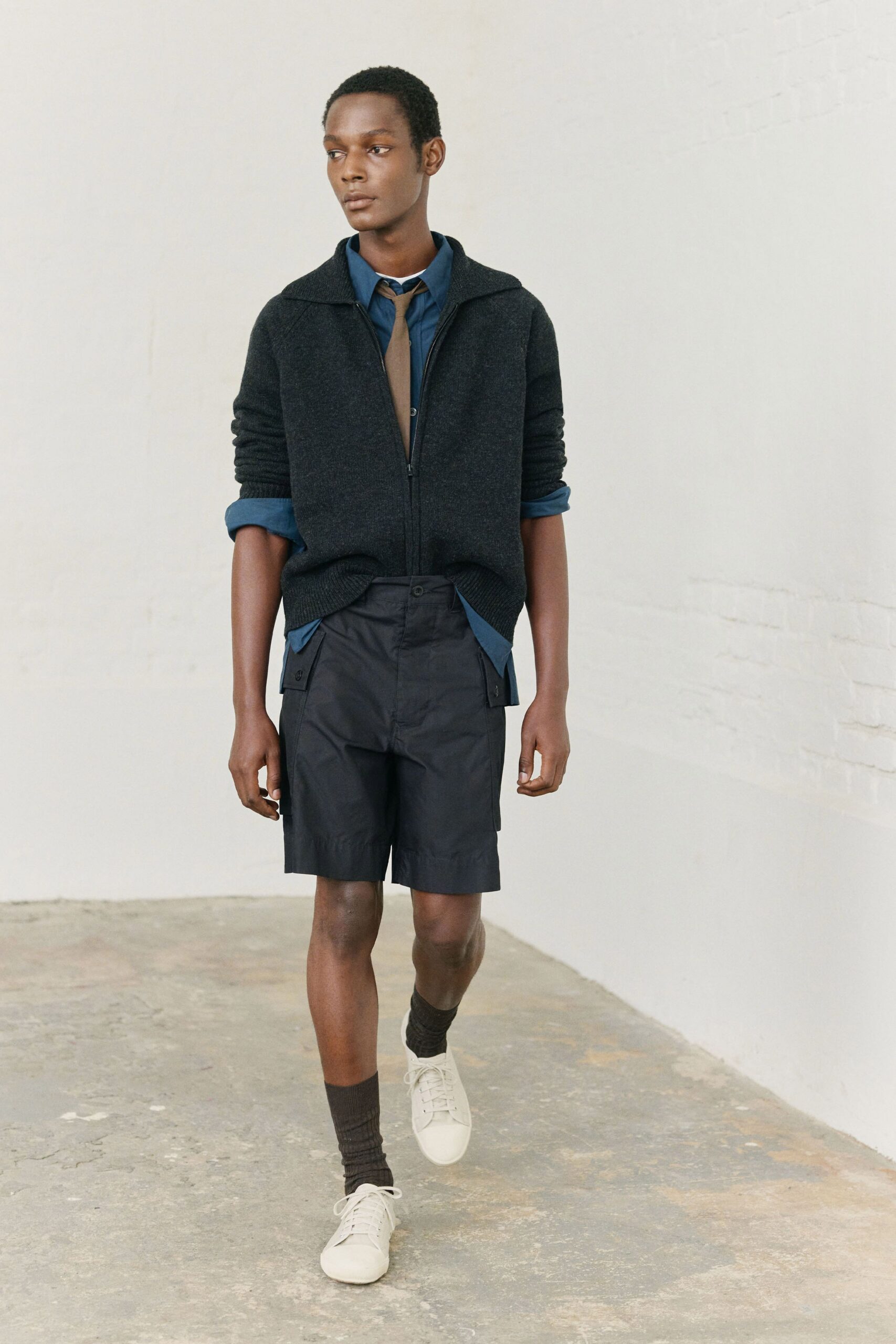 black hoodie blue shirt black shorts