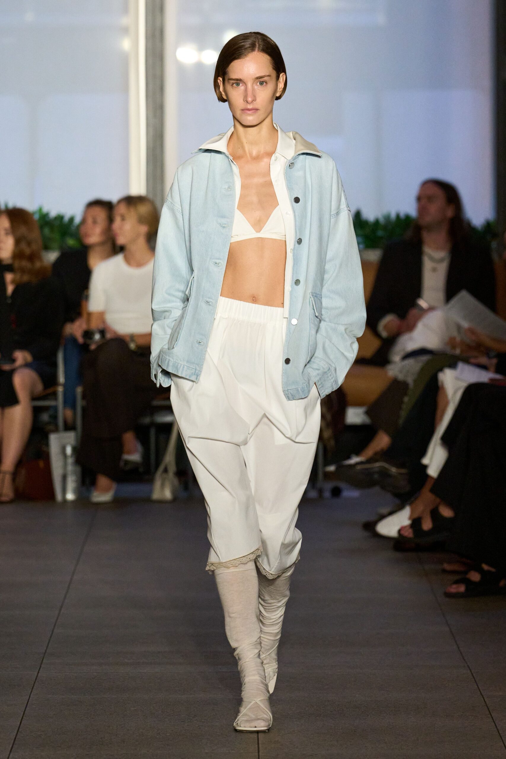 light blue denim jacket with white top and pants