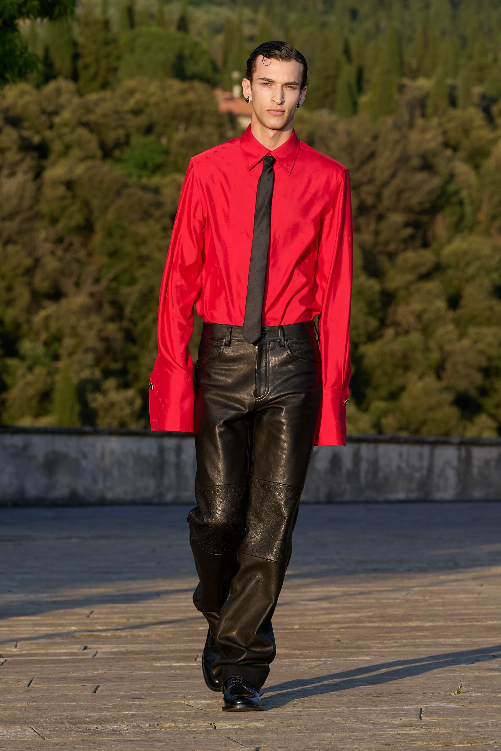 red shirt black leather pants