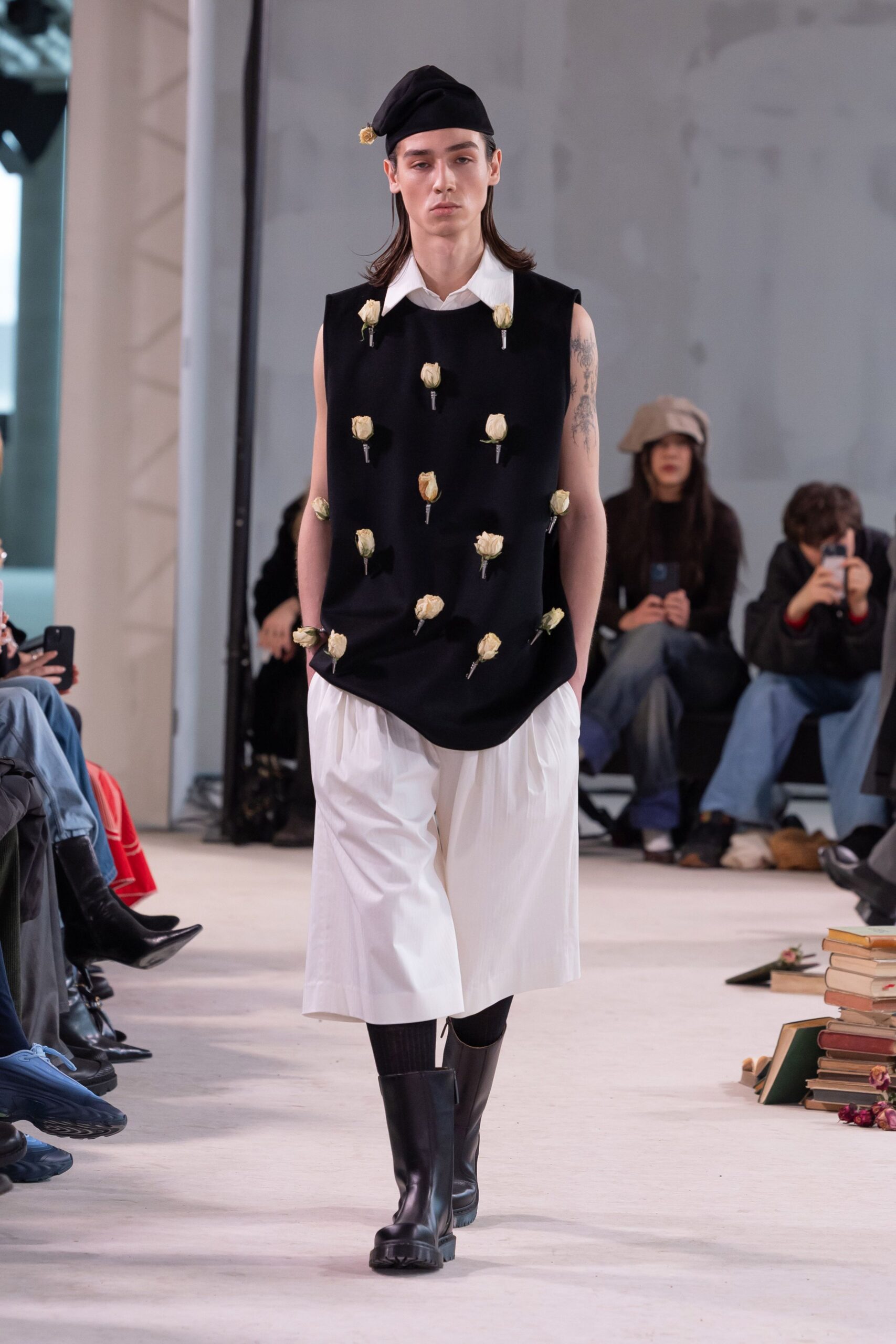 black sleeveless top white pants