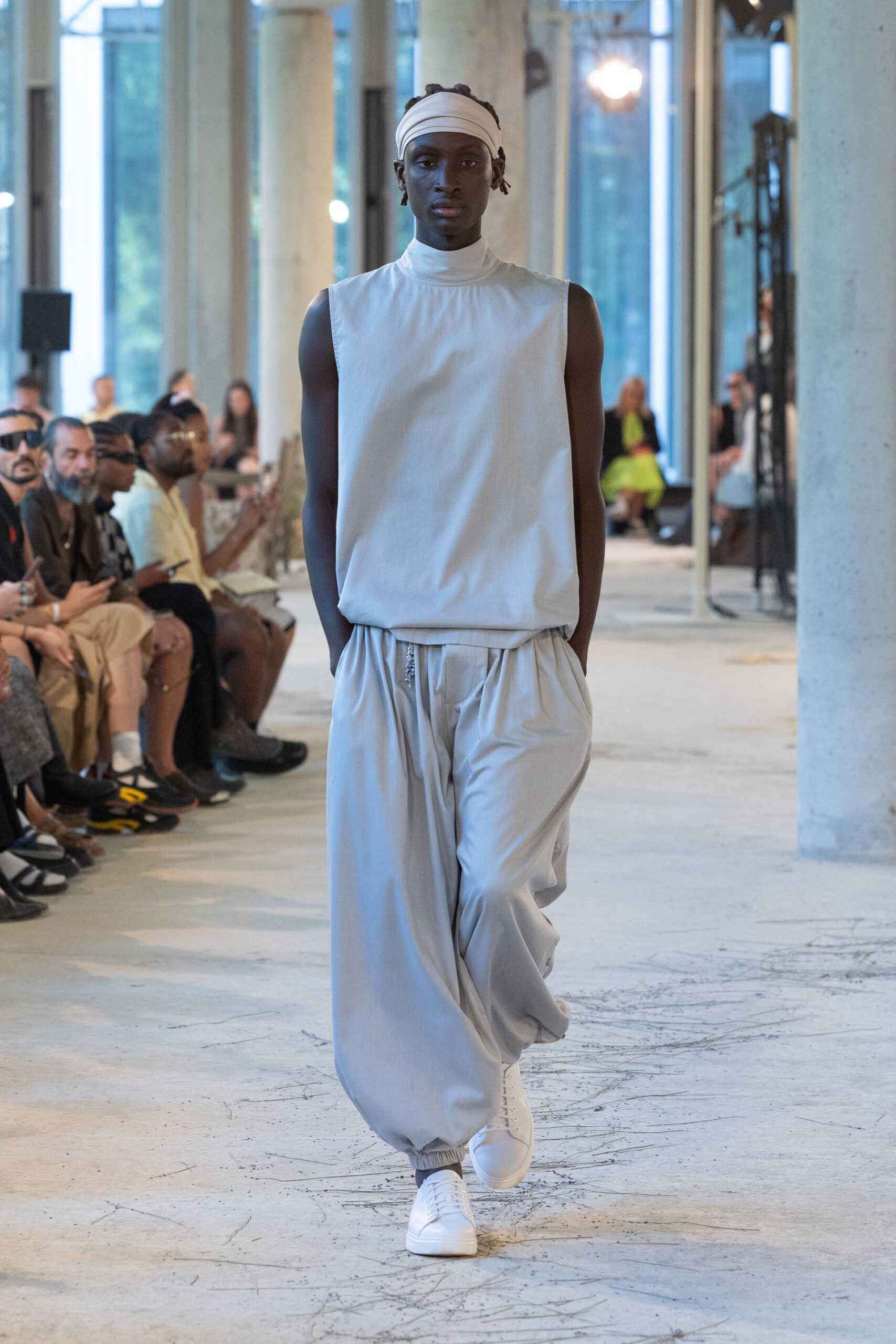 white sleeveless top gray pants