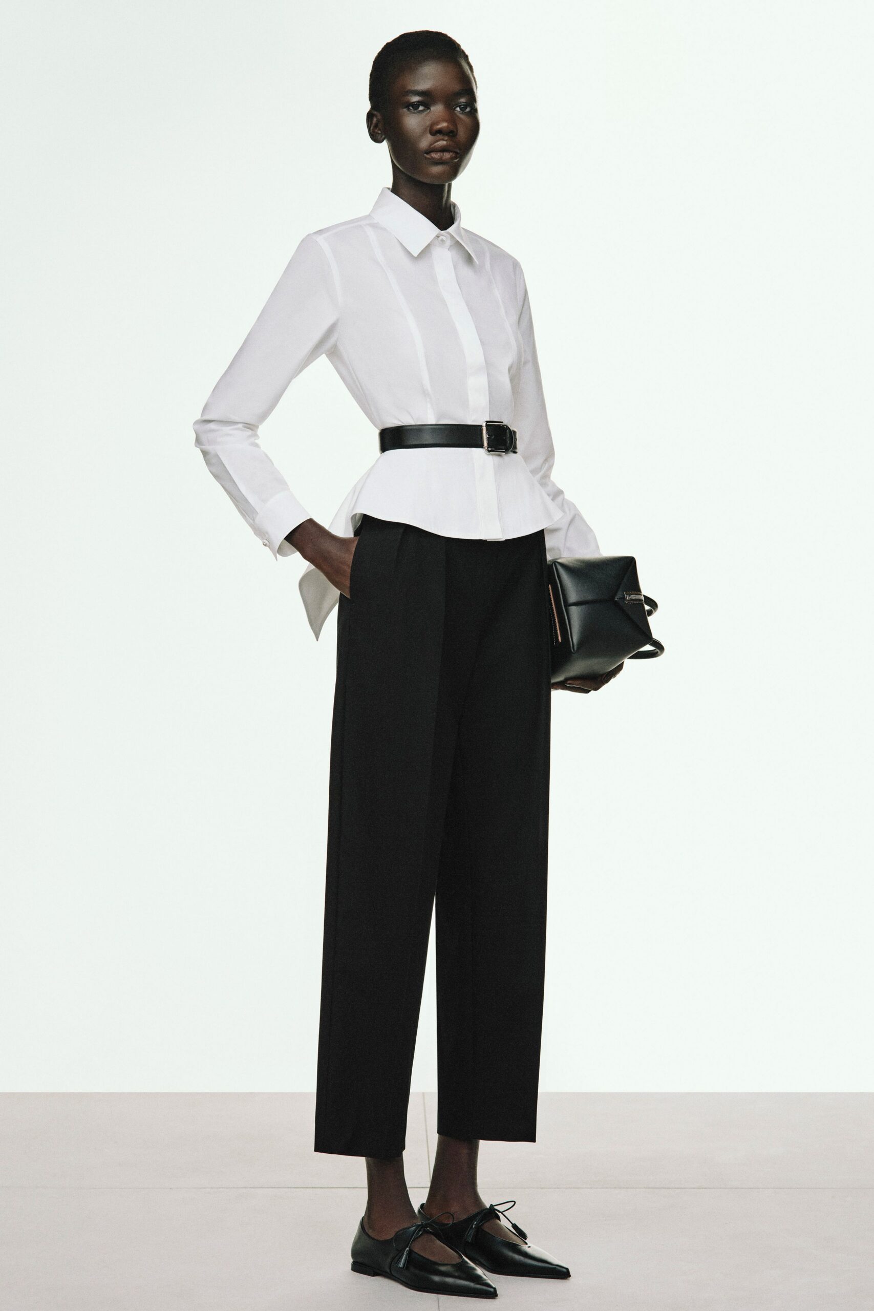white fitted shirt with black pants
