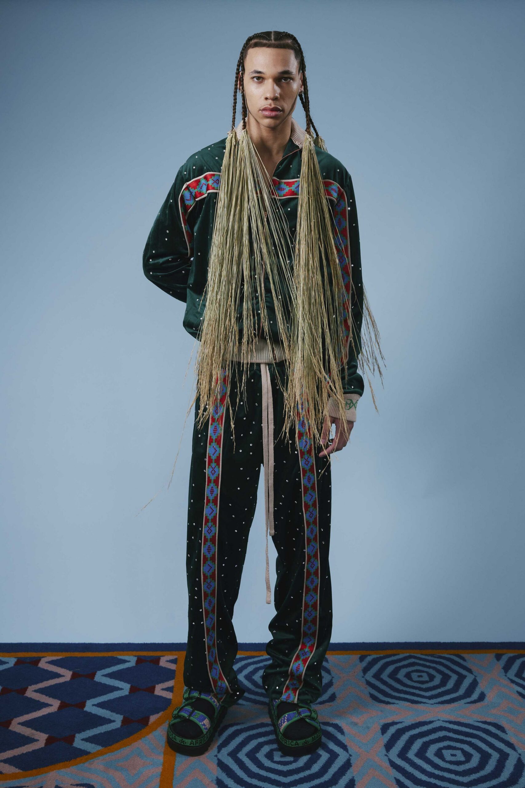 green embroidered shirt with black pants
