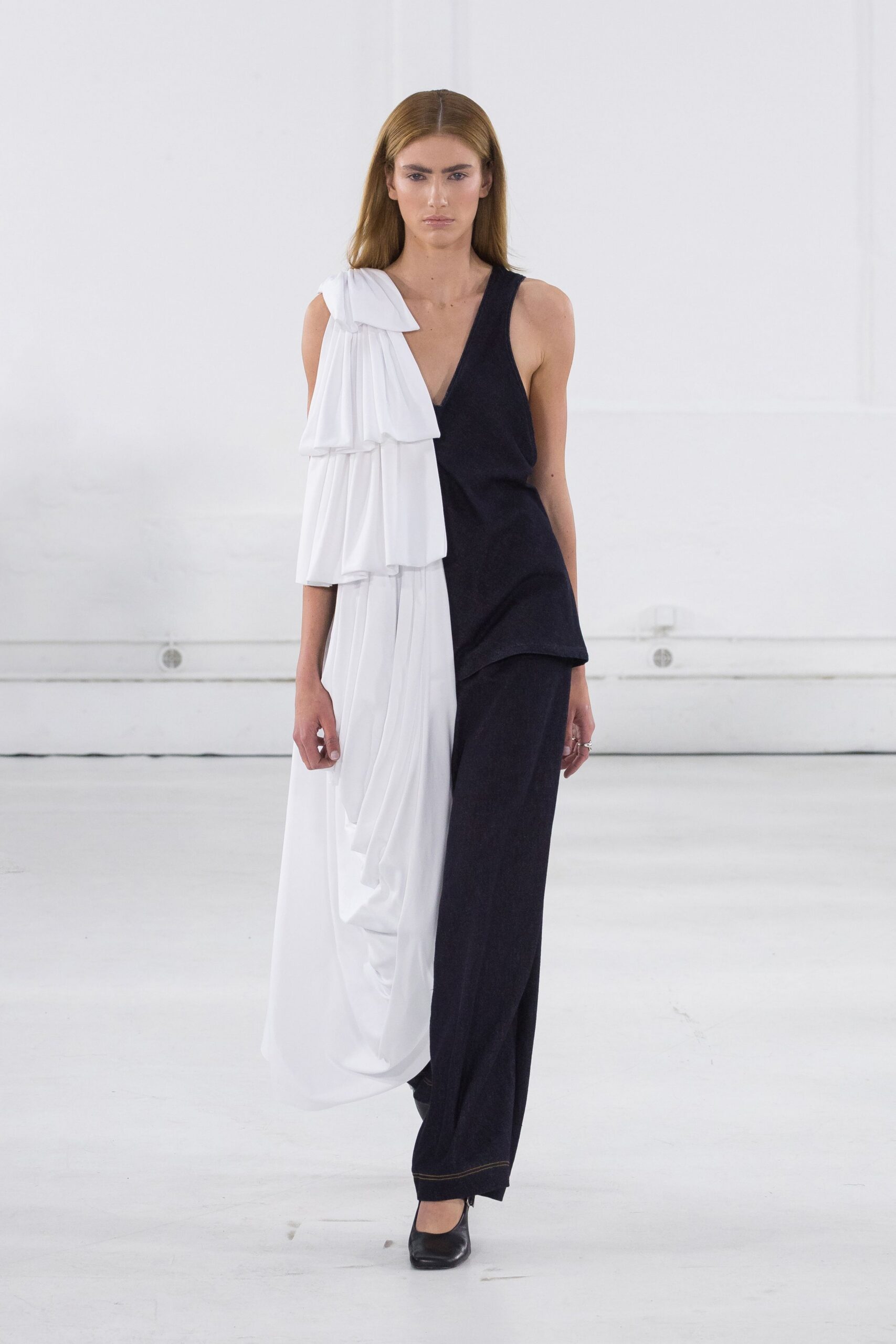 black cotton sleeveless v-neck fitted pleated draped jumpsuit