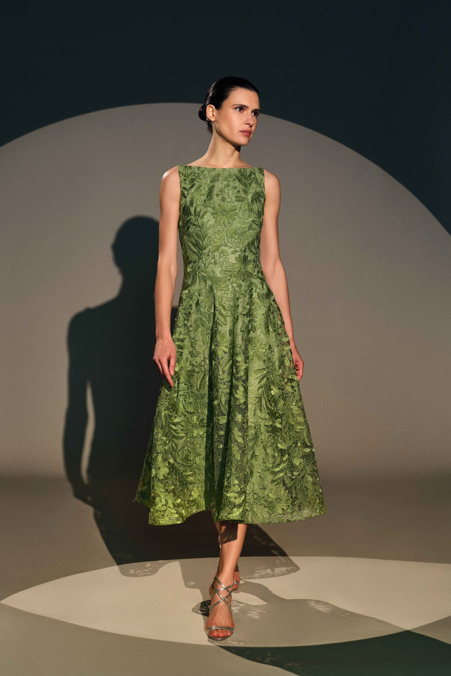 green embroidered midi dress with strappy shoes