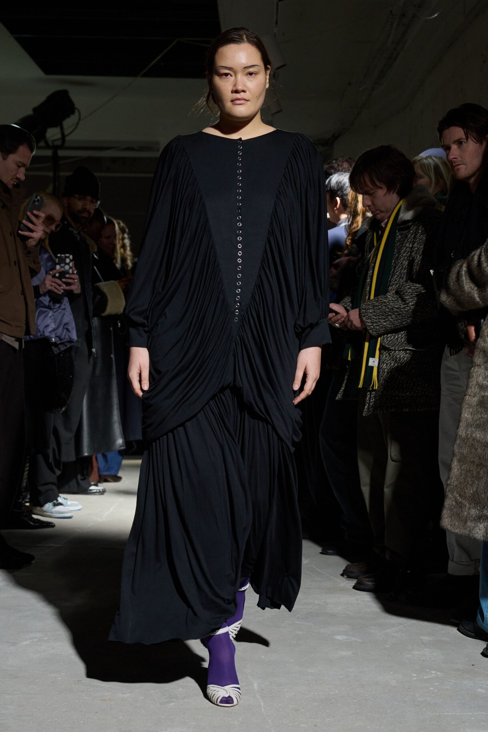 black relaxed draped maxi dress with purple shoes