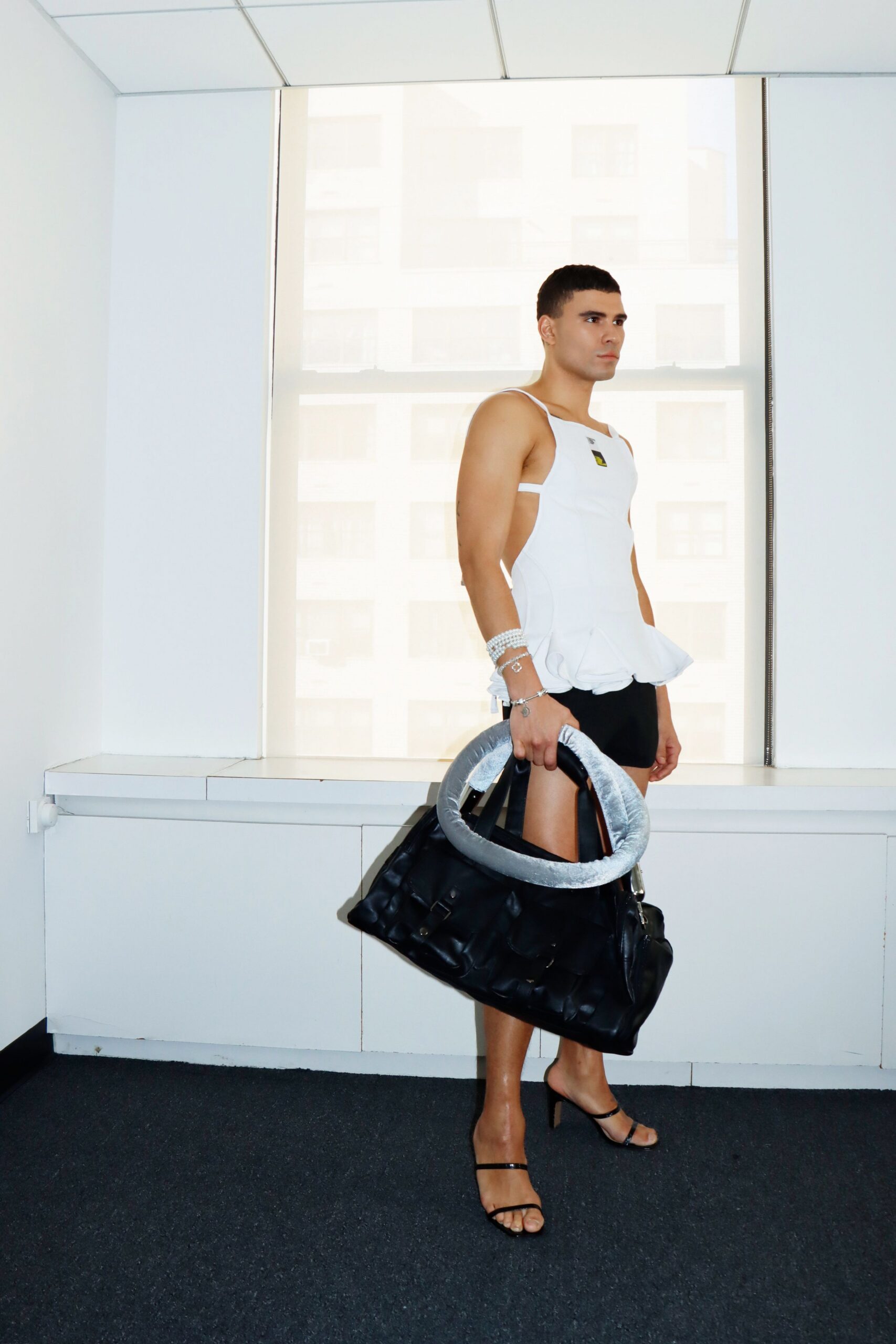 white fitted top with black shorts