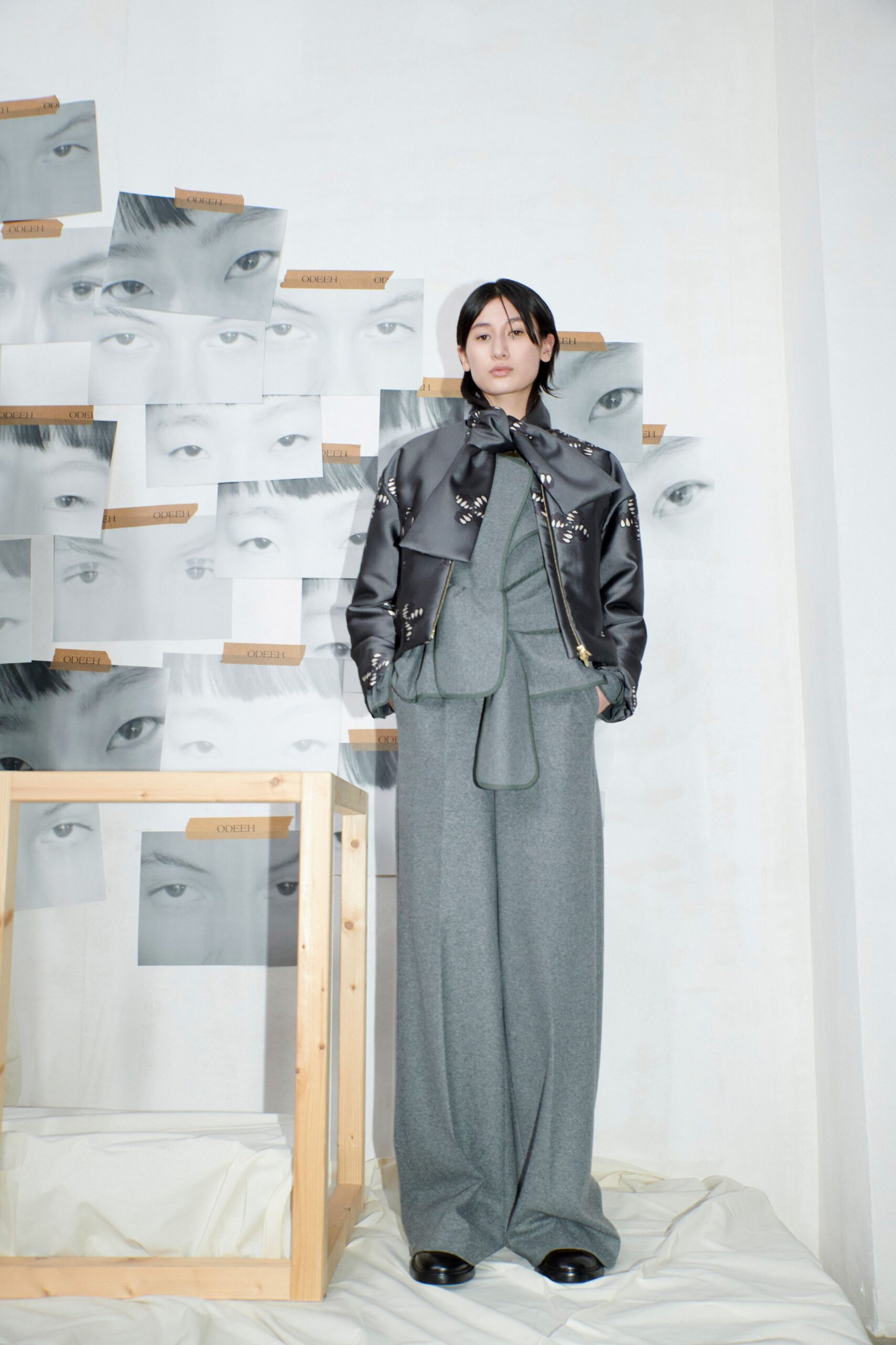 black leather jacket gray top pants