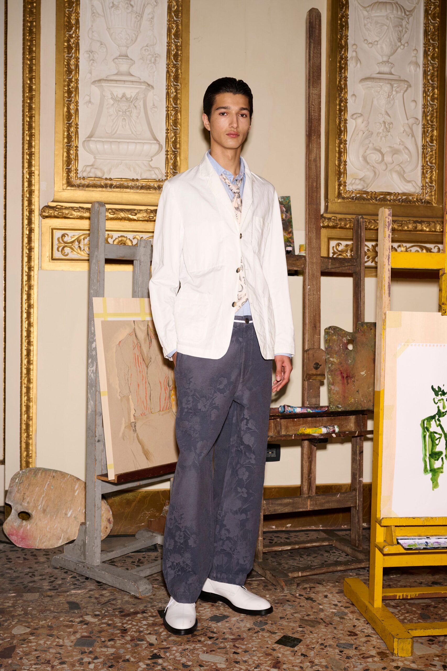 white blazer beige shirt blue pants