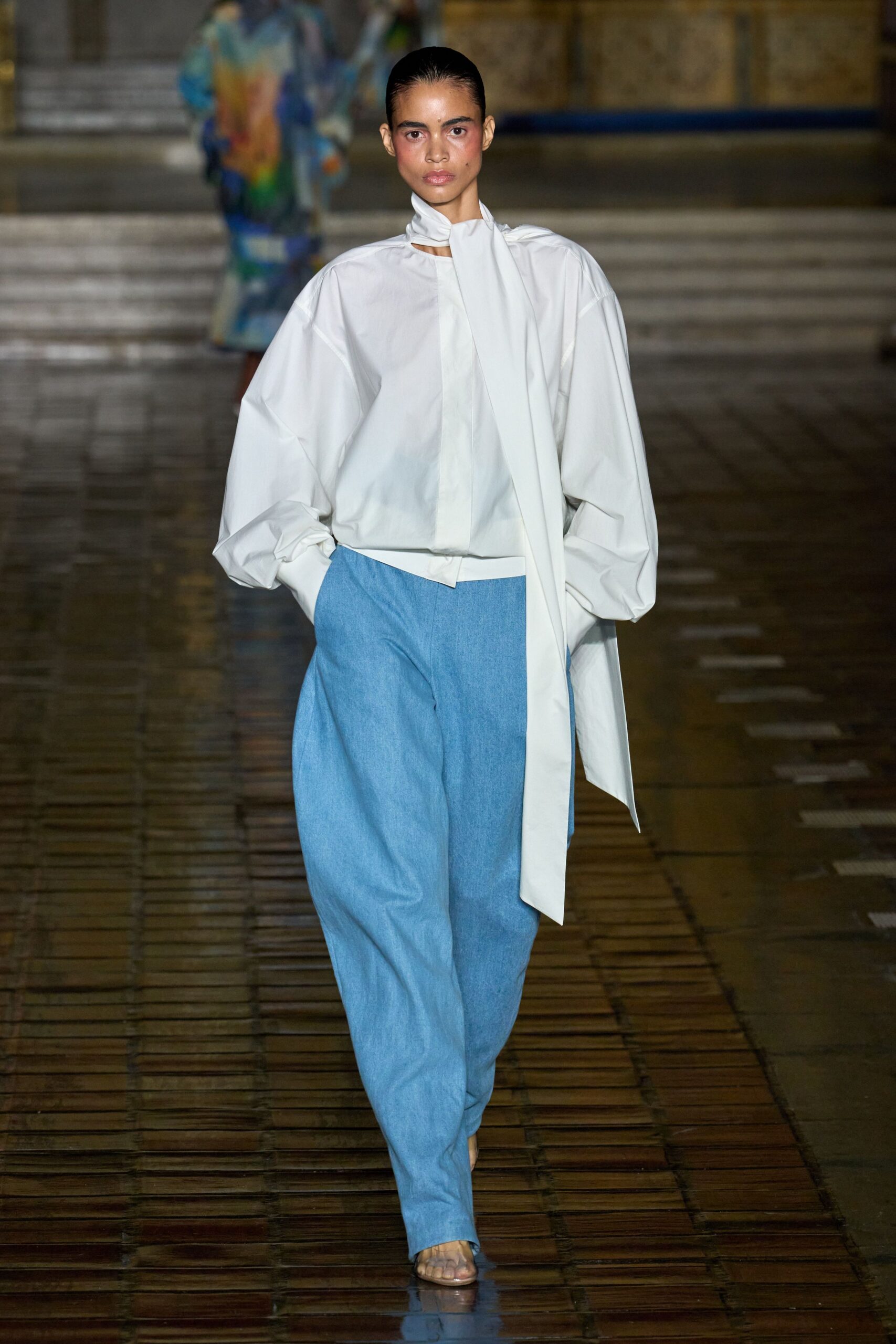 white relaxed blouse with blue pants