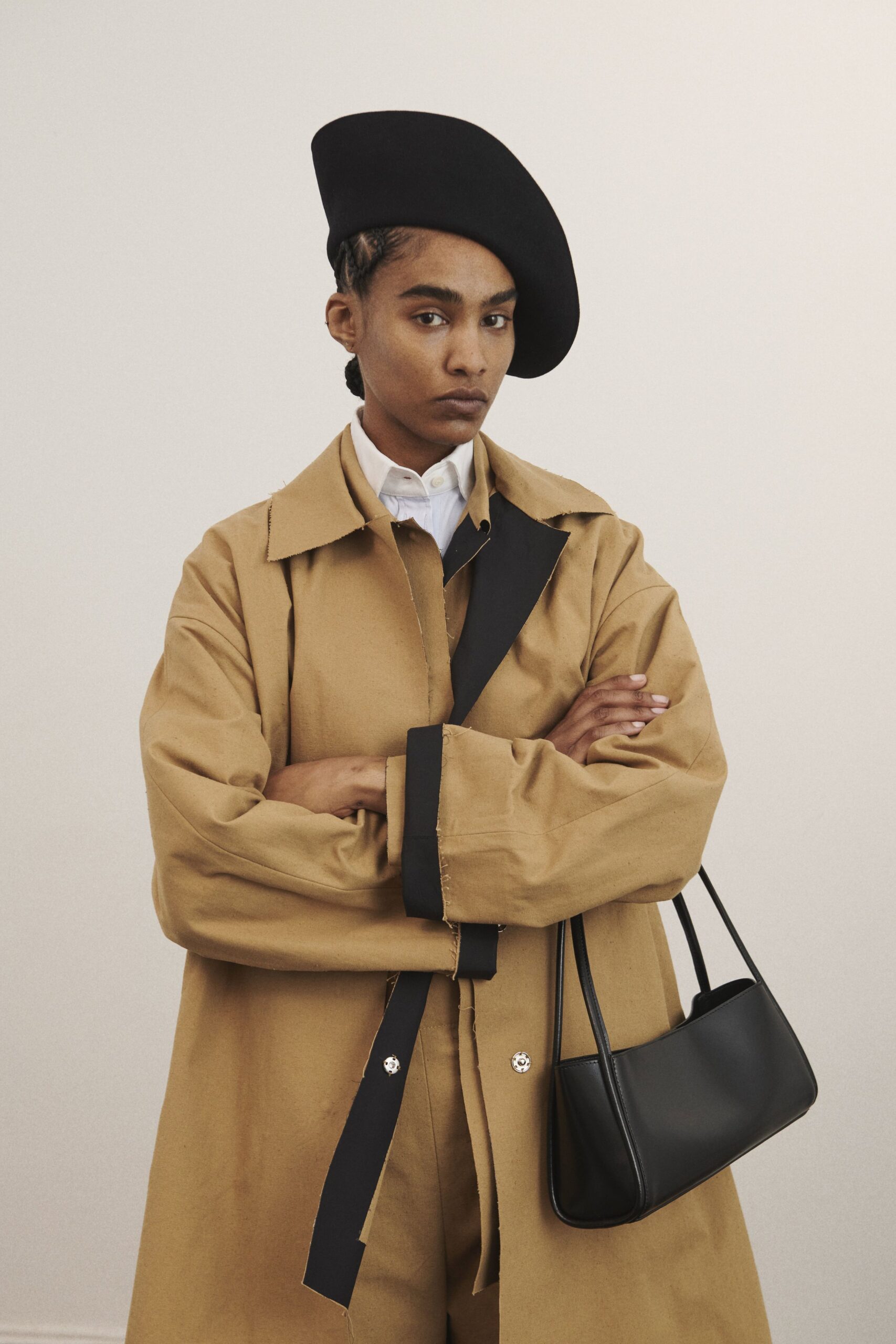 beige coat white shirt black accessories