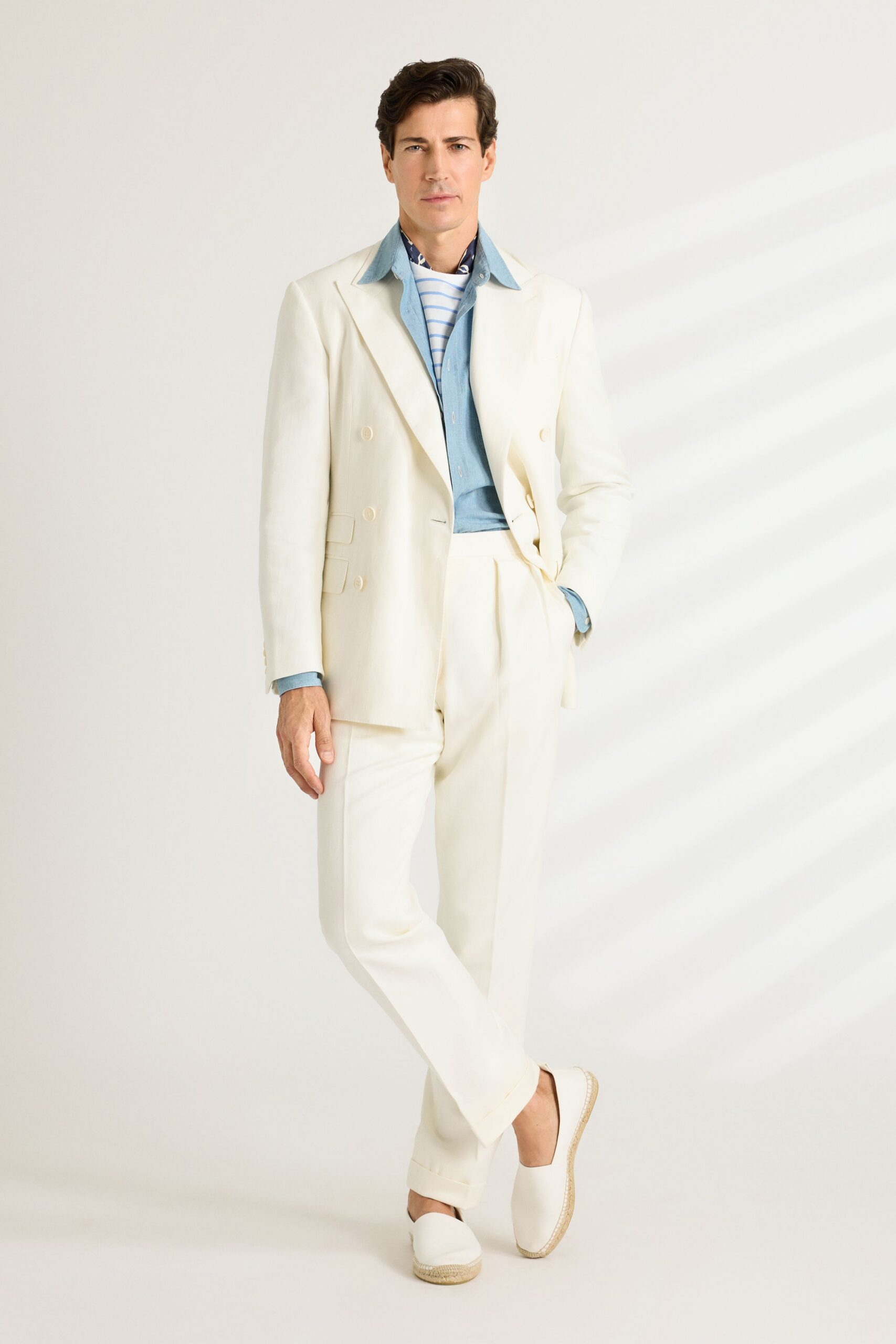 white tailored suit with blue shirt