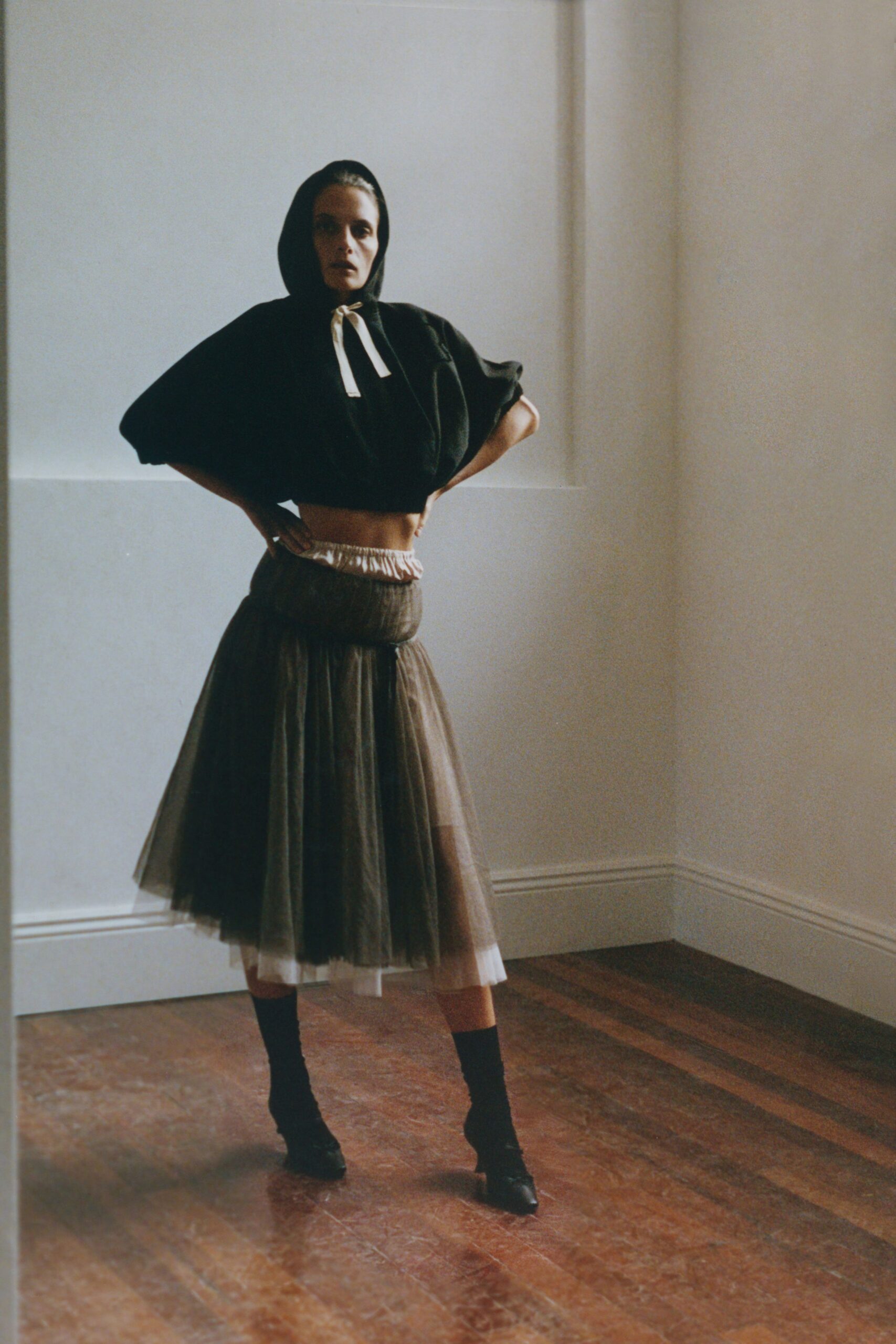 black hooded top with brown tulle skirt