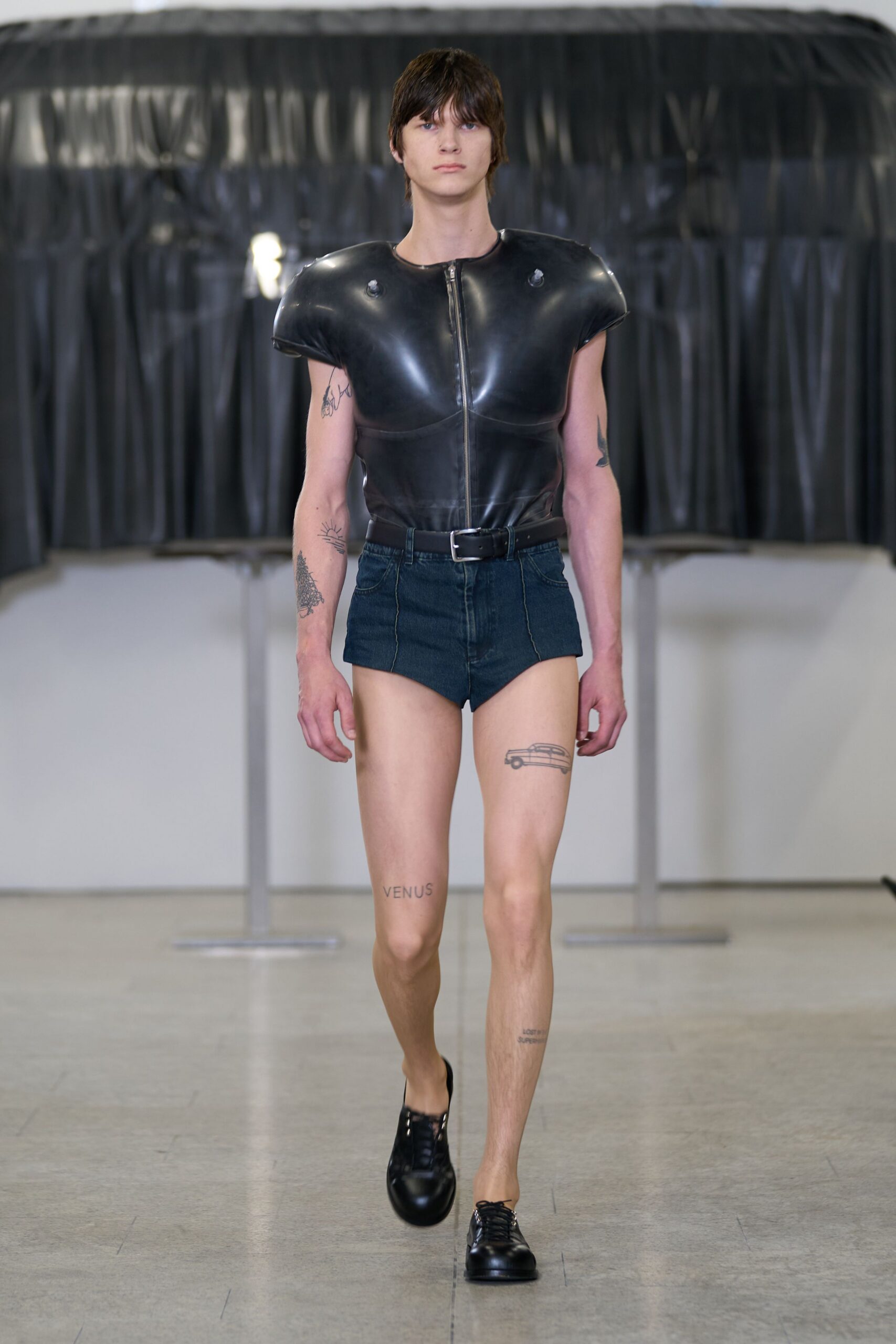 black leather top with denim shorts