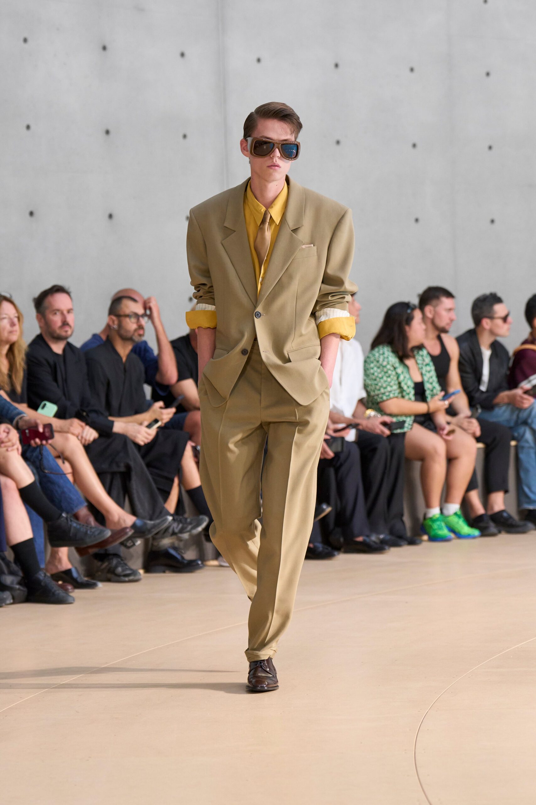 beige tailored suit with yellow shirt