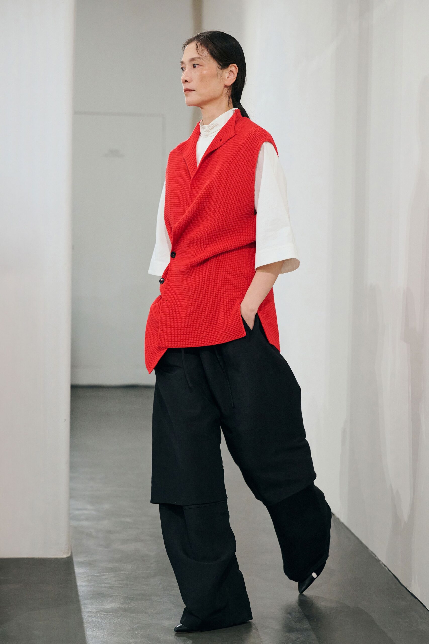 red vest white shirt black pants