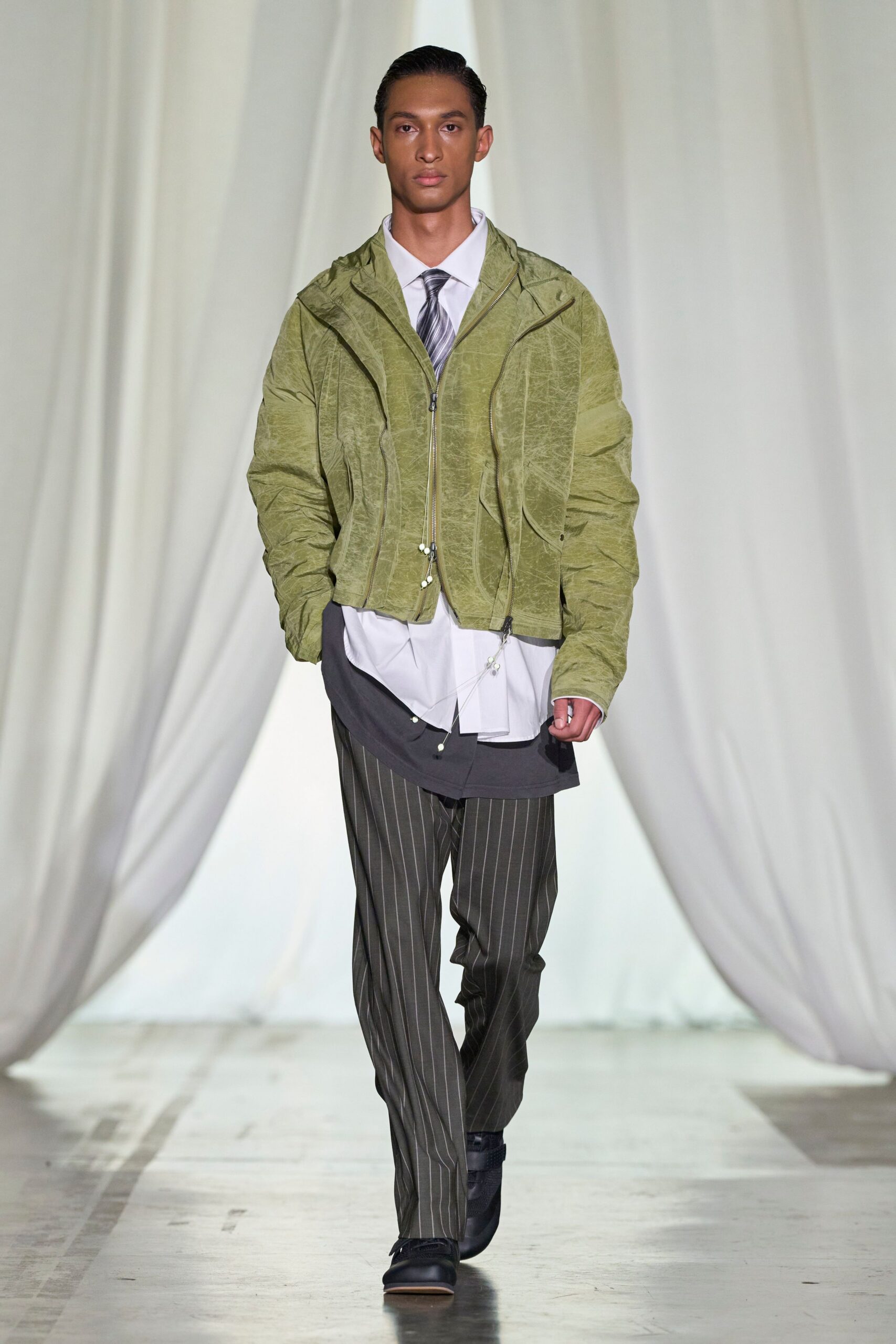 green relaxed jacket with striped pants