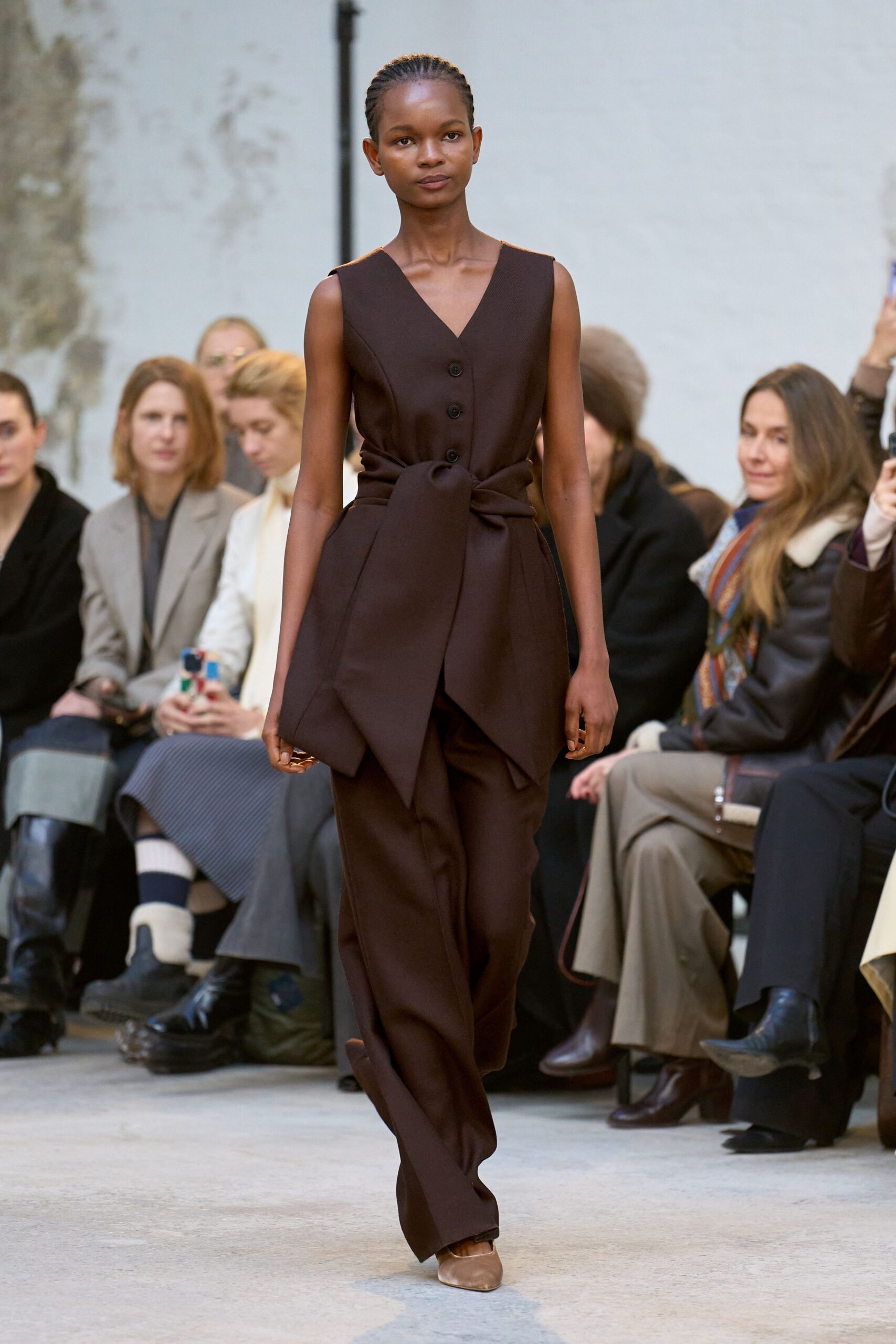 brown belted jumpsuit with shoes
