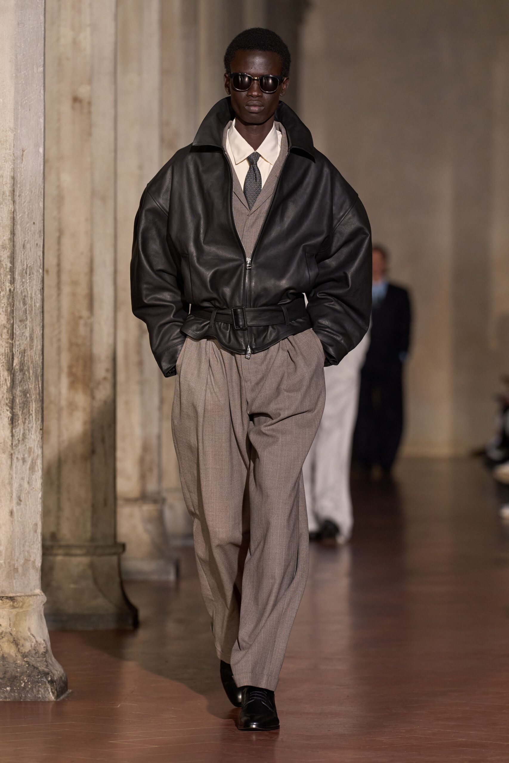 black leather long-sleeve collared oversized zippered belted jacket