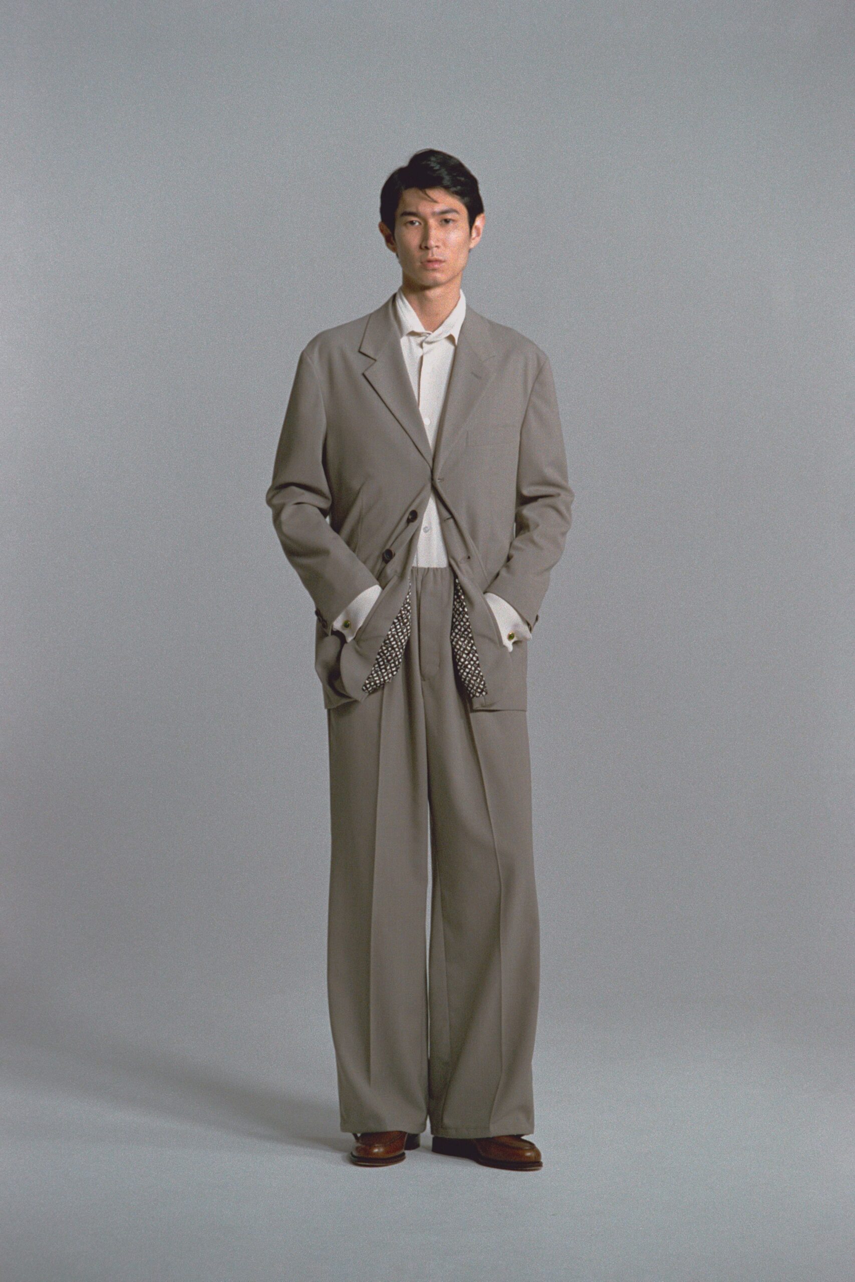 gray relaxed suit with white shirt