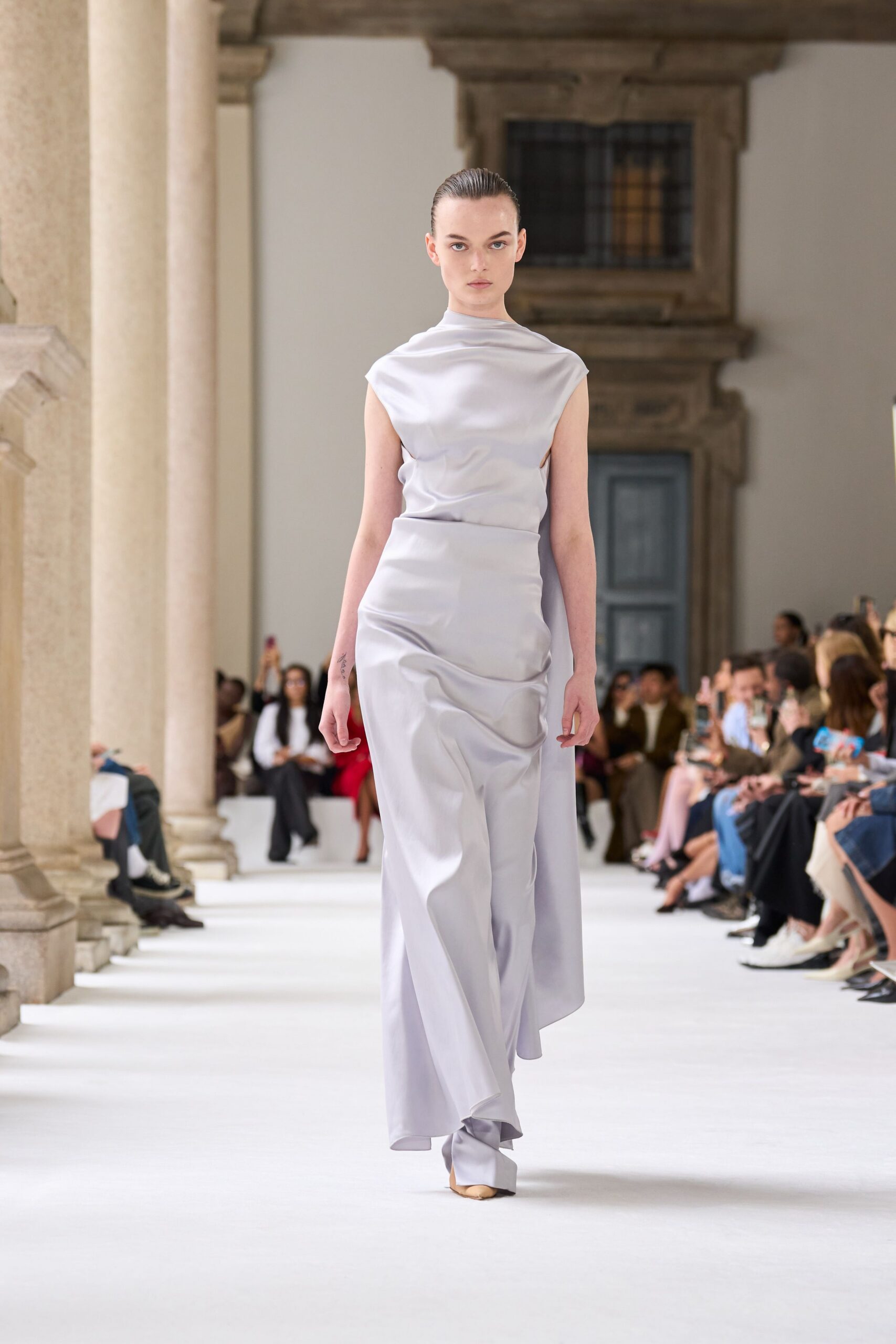 gray silk sleeveless high-neck fitted draped flowing gown