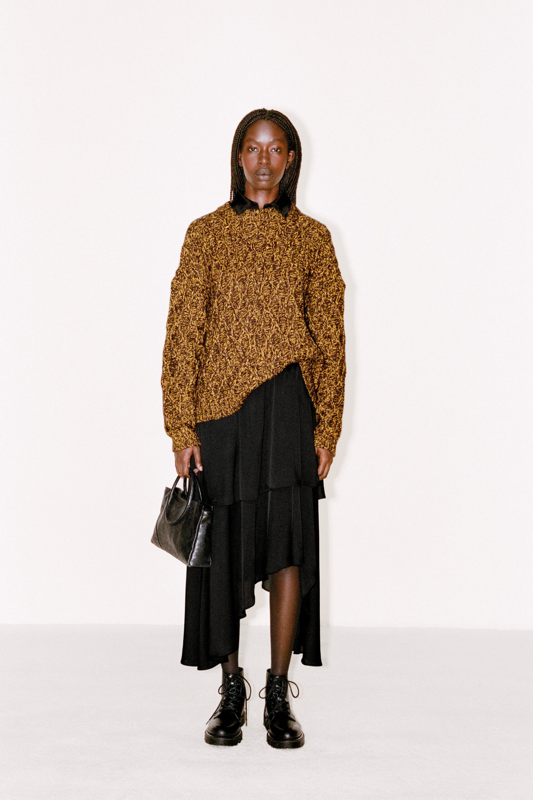 brown wool relaxed sweater with black skirt