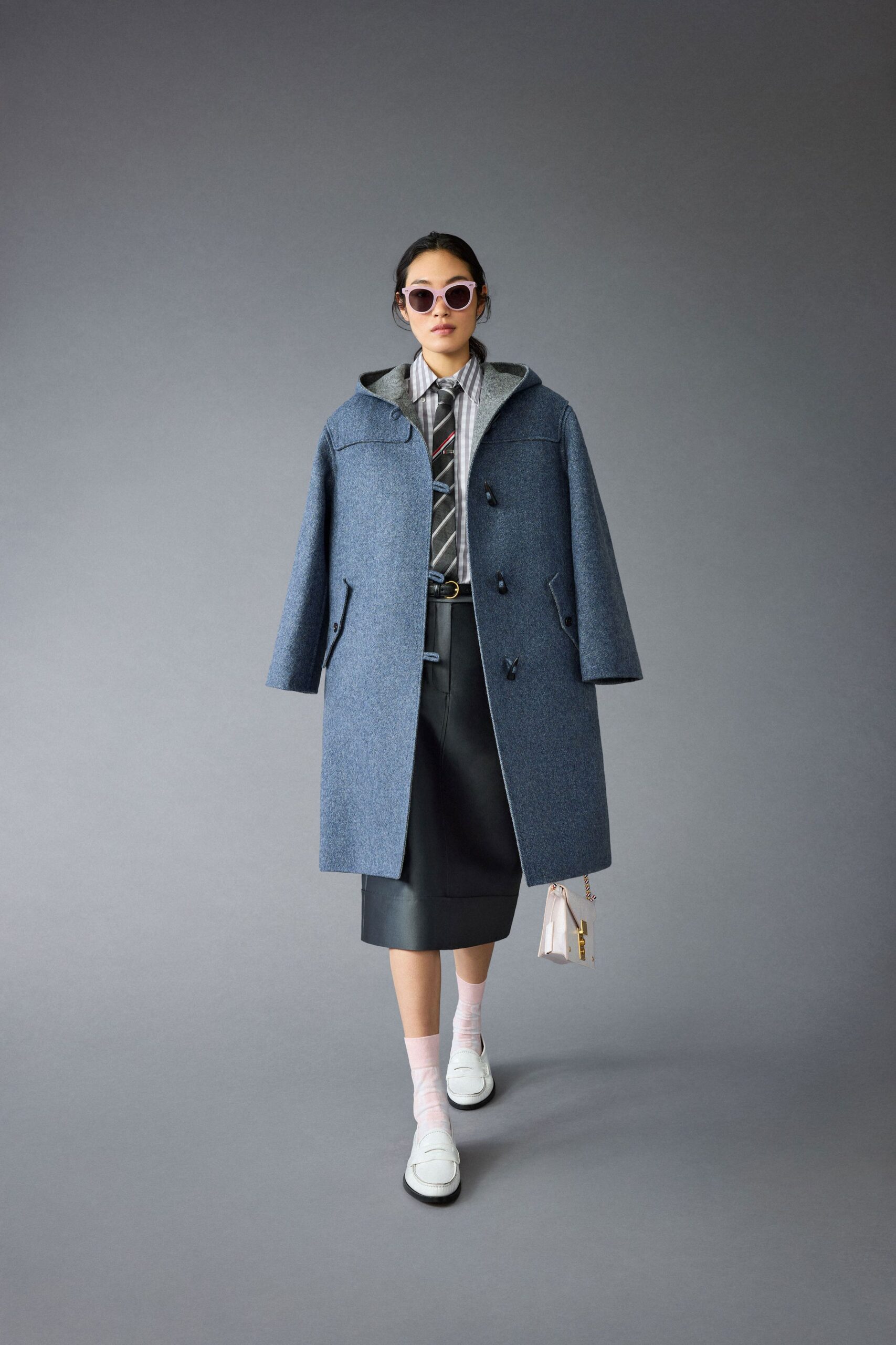 blue wool coat with black skirt