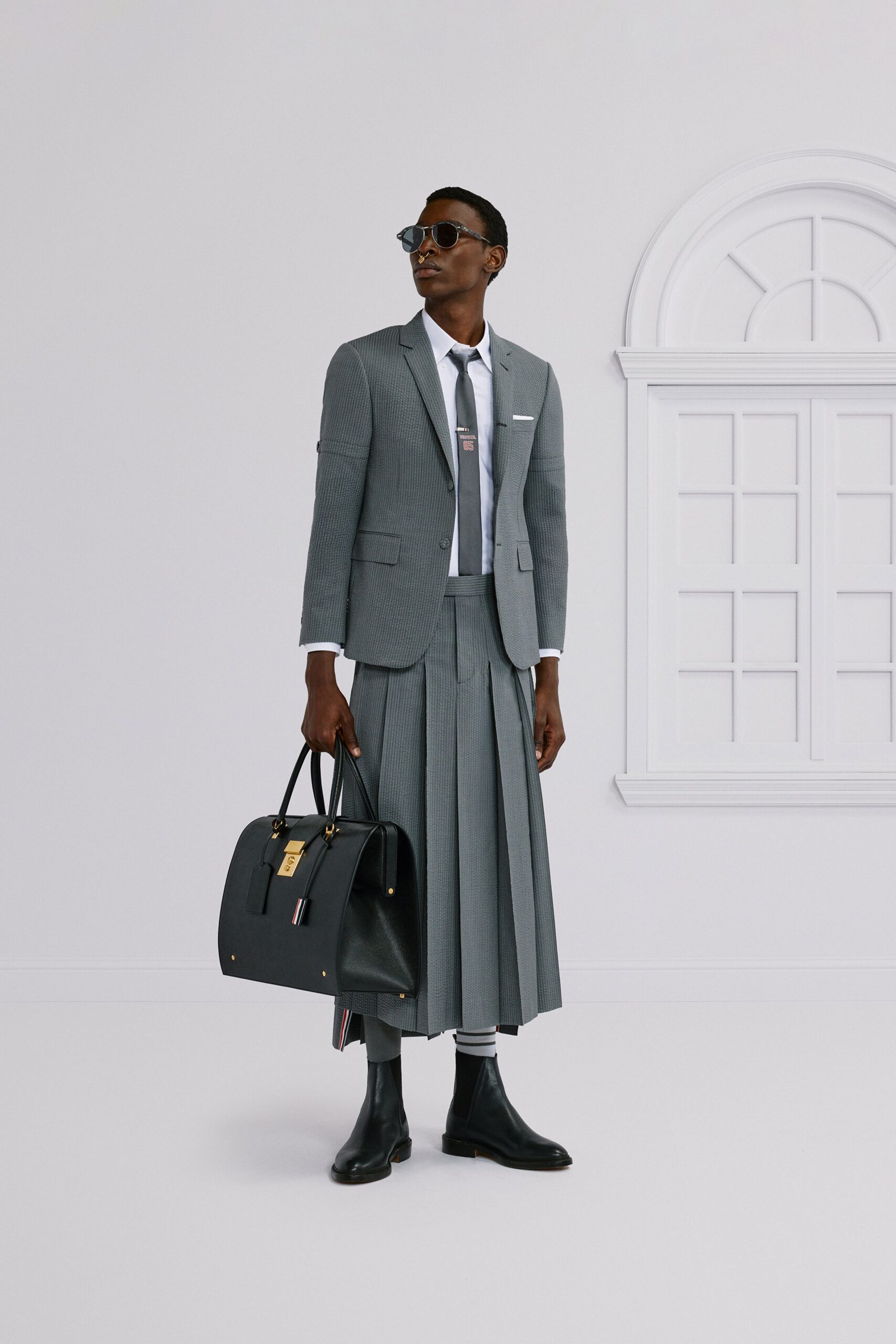 gray tailored blazer with pleated skirt