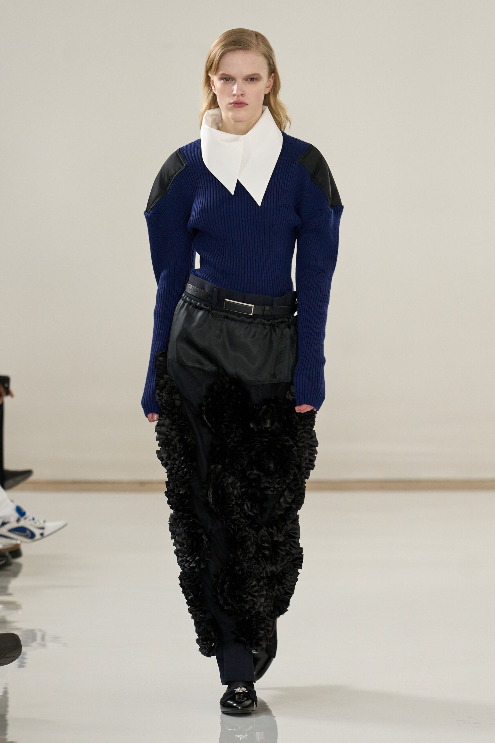 blue fitted top with pleated pants