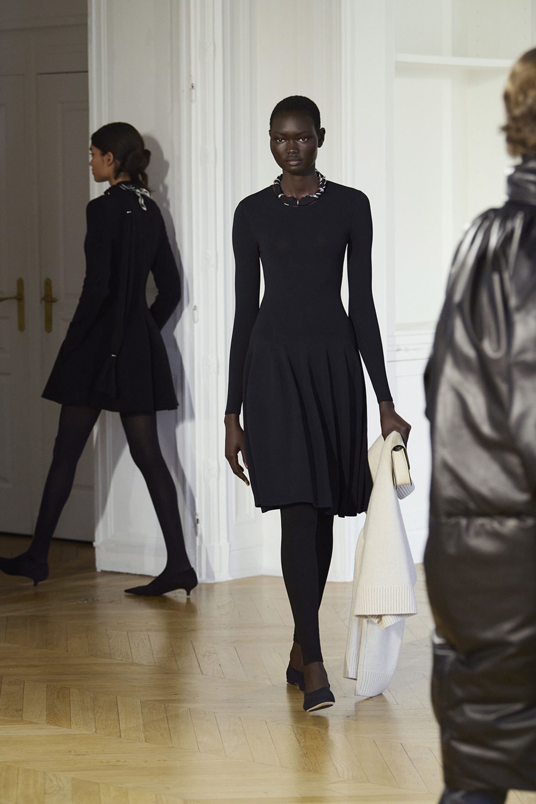 black fitted mini dress with leggings