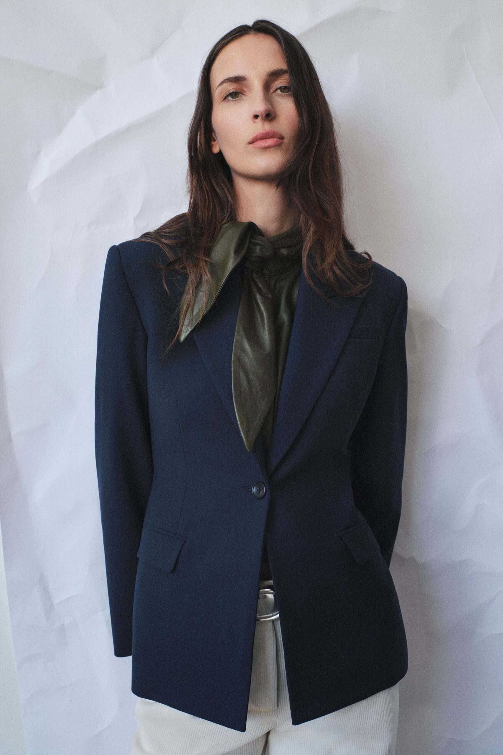 navy tailored blazer with green top