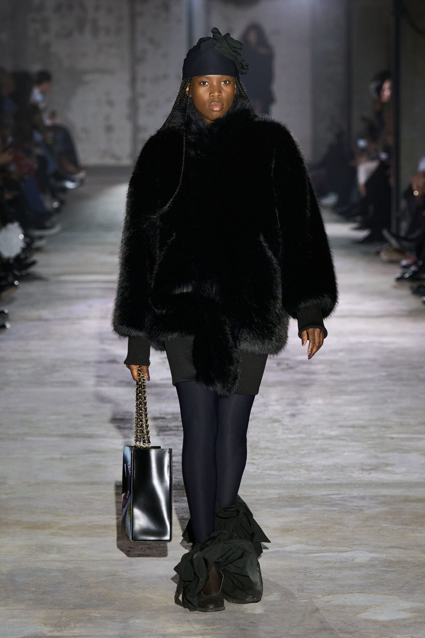 black faux-fur coat with ruffled skirt